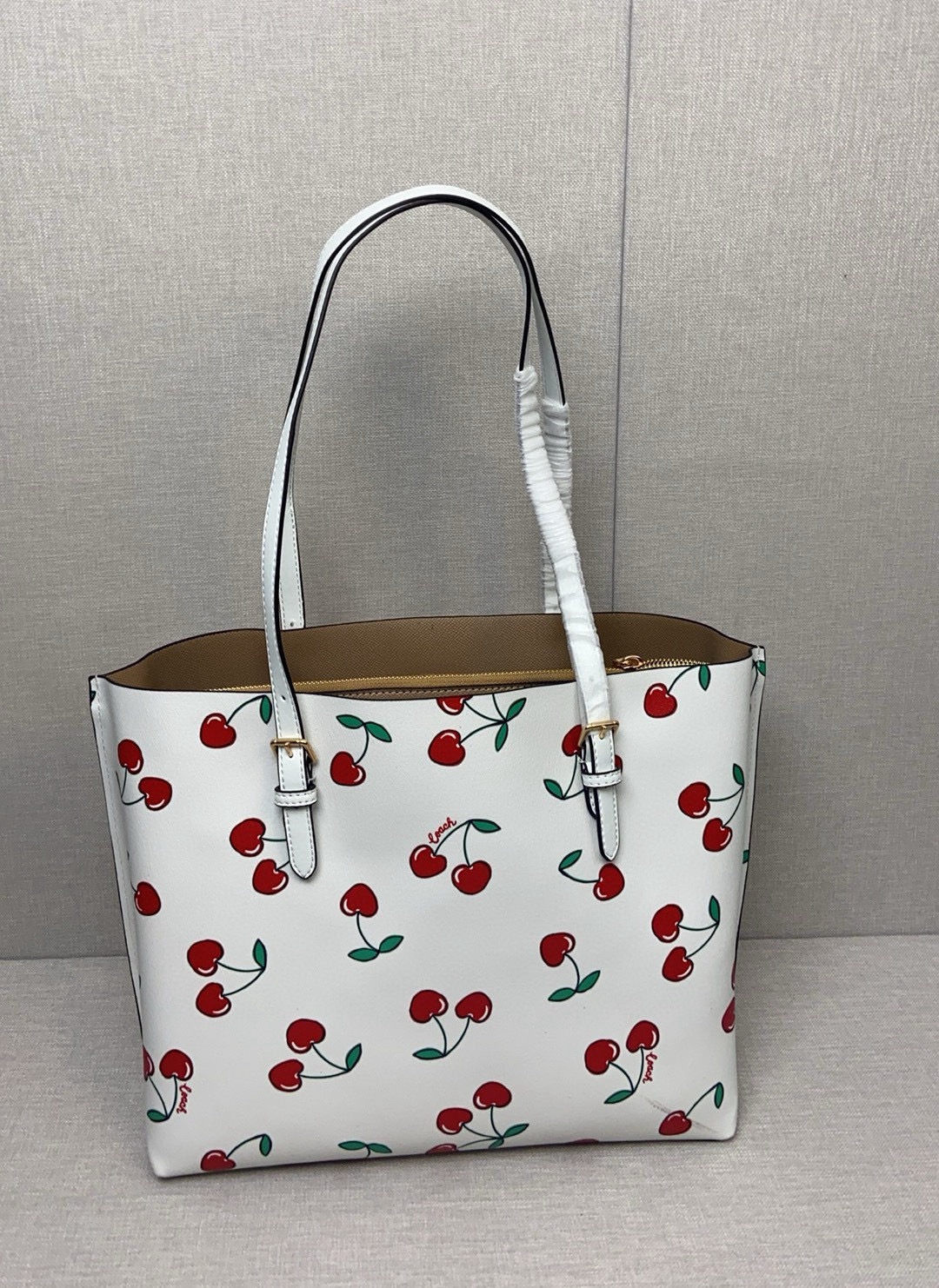 coa*h mollietote印花托特包 三隔层デザインの実用的トートバッグ