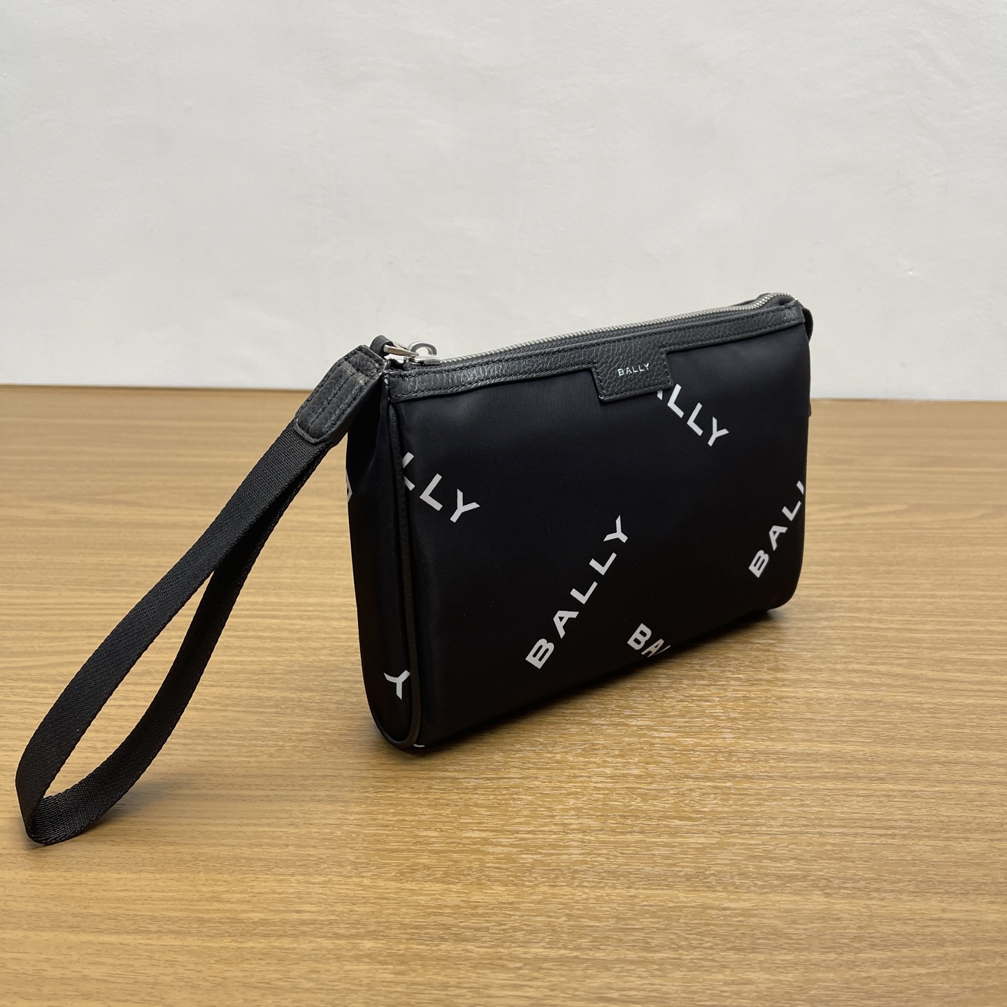 Bally Actual photo of black clutch bag.