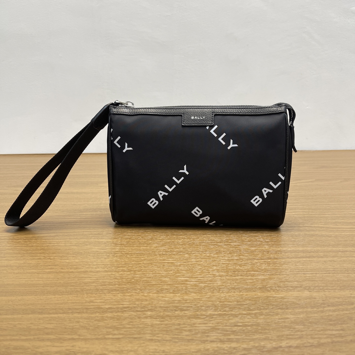 Bally Actual photo of black clutch bag.