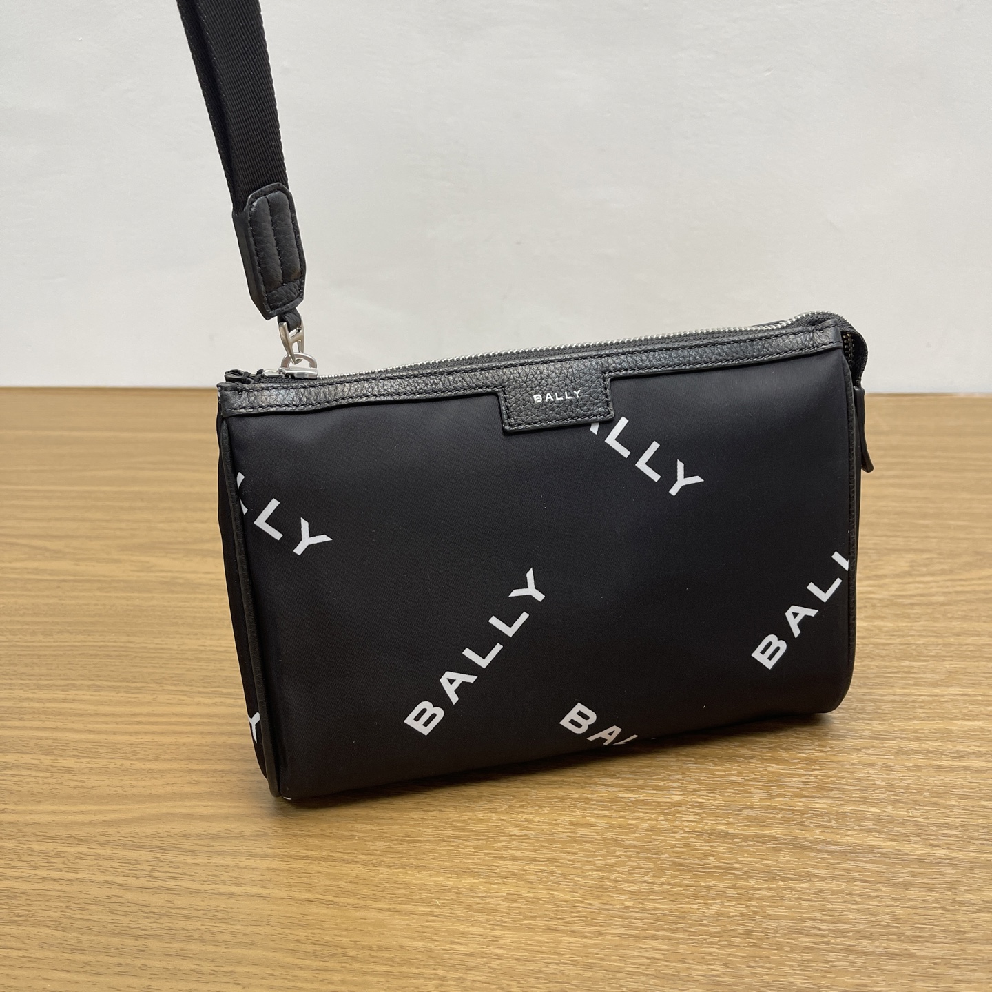 Bally Black clutch bag enlarged detail image.