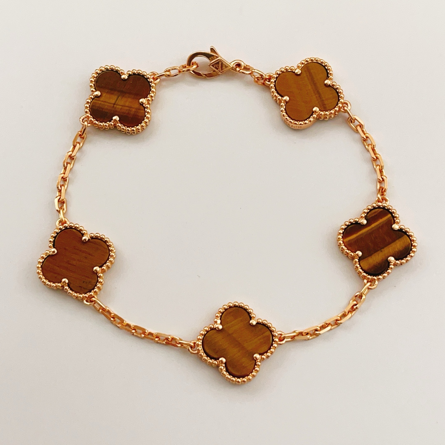 Van Cleef Arpels Bracelet Vintage Alhambra Or rose avec incrustations de pierres œil de tigre marron 18cm