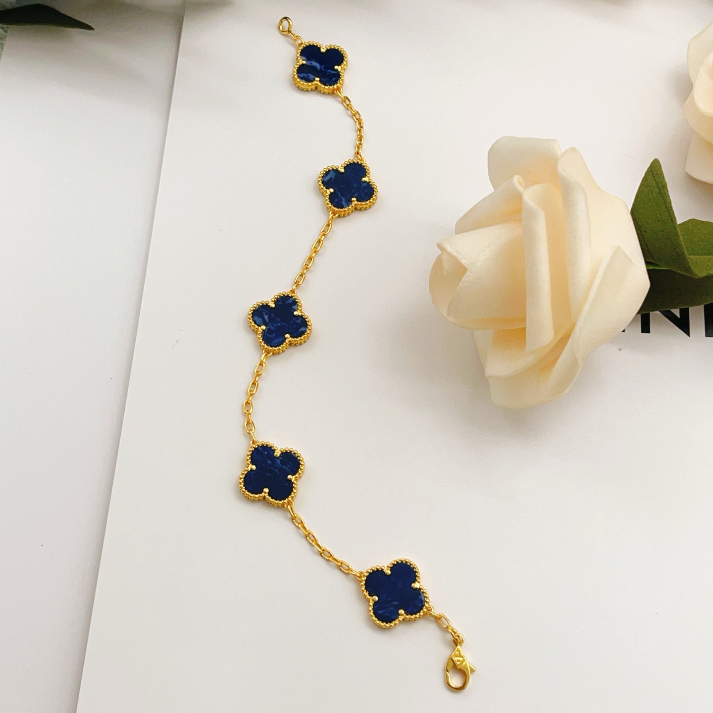 Van Cleef Arpels Alhambra bracelet Yellow gold with dark blue pietersite stone inlays 18cm