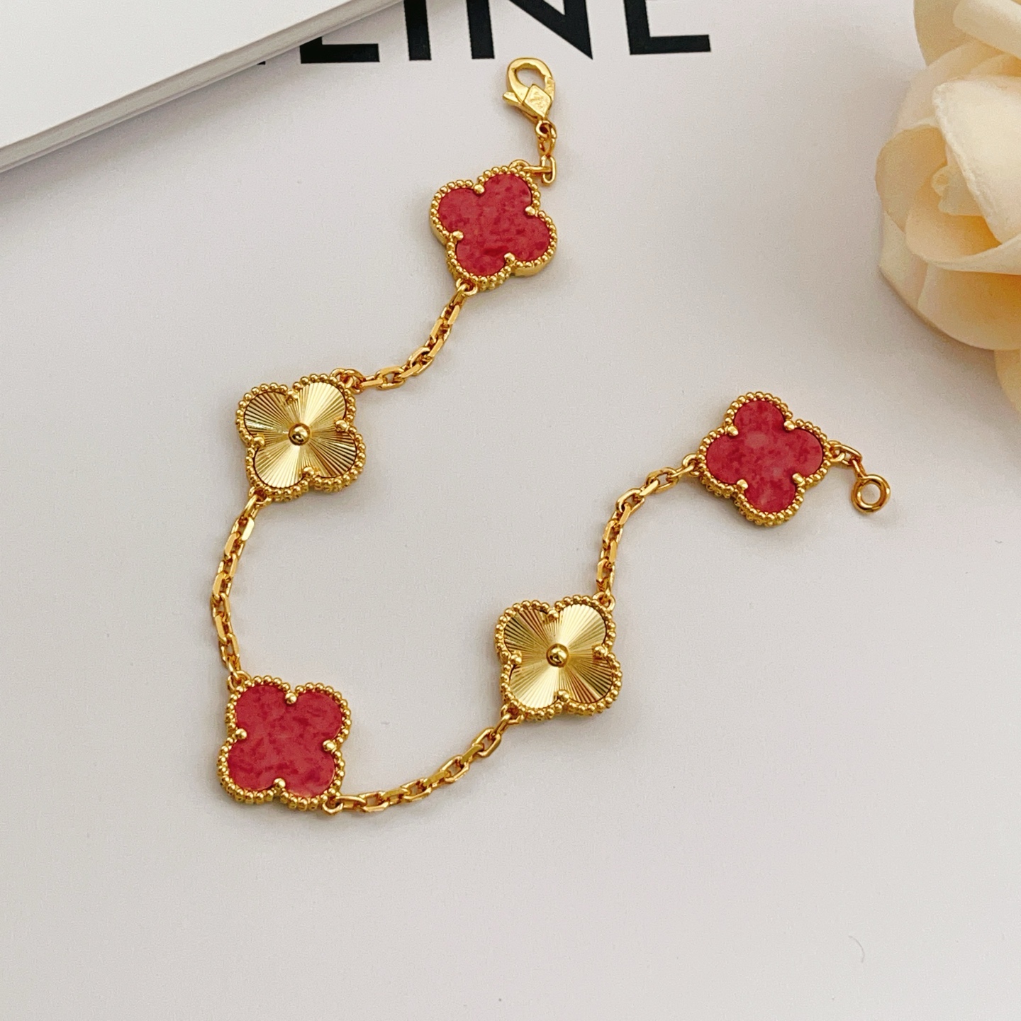 Van Cleef Arpels Vintage Alhambra bracelet Yellow gold with red stone inlays and guilloche gold motifs 18cm