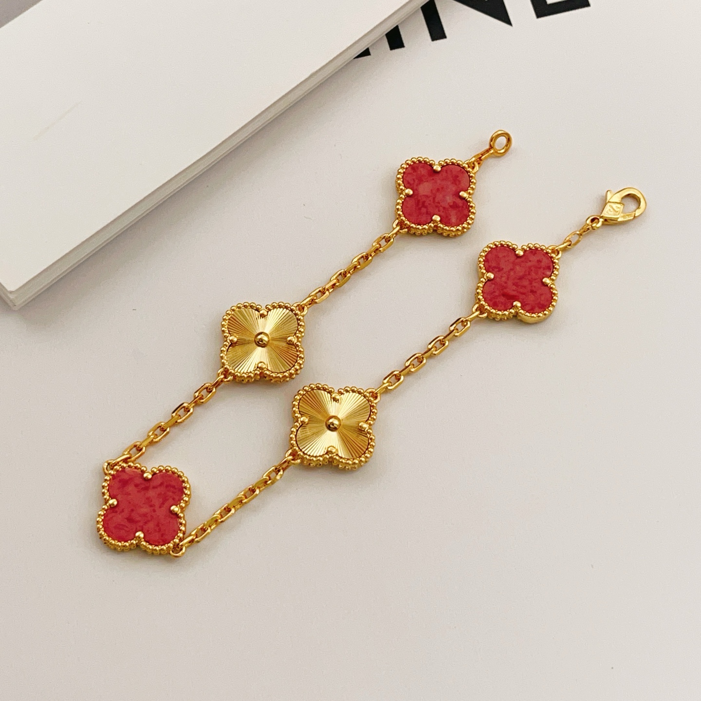Van Cleef Arpels Vintage Alhambra bracelet Yellow gold with red stone inlays and guilloche gold motifs 18cm