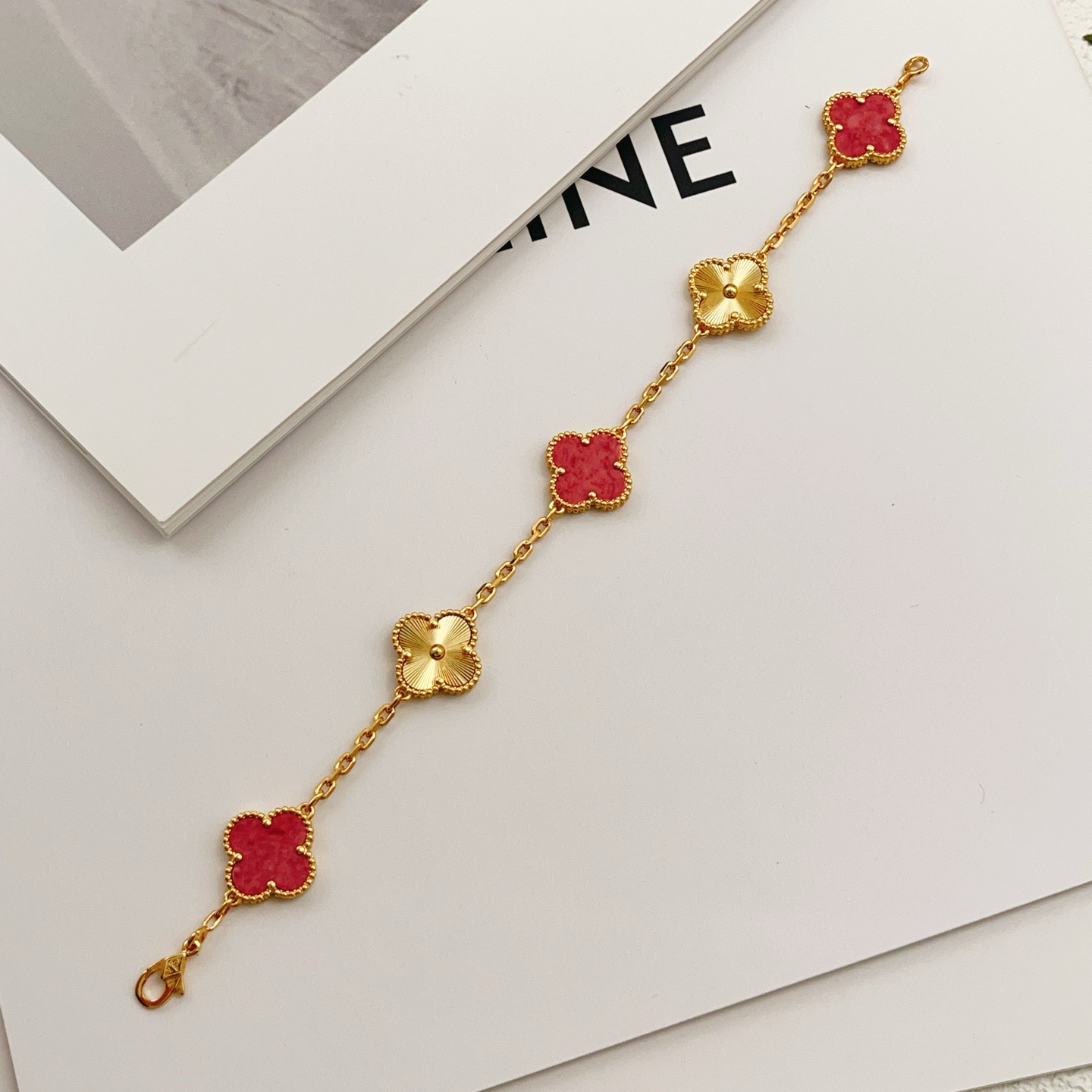 Van Cleef Arpels Vintage Alhambra bracelet Yellow gold with red stone inlays and guilloche gold motifs 18cm