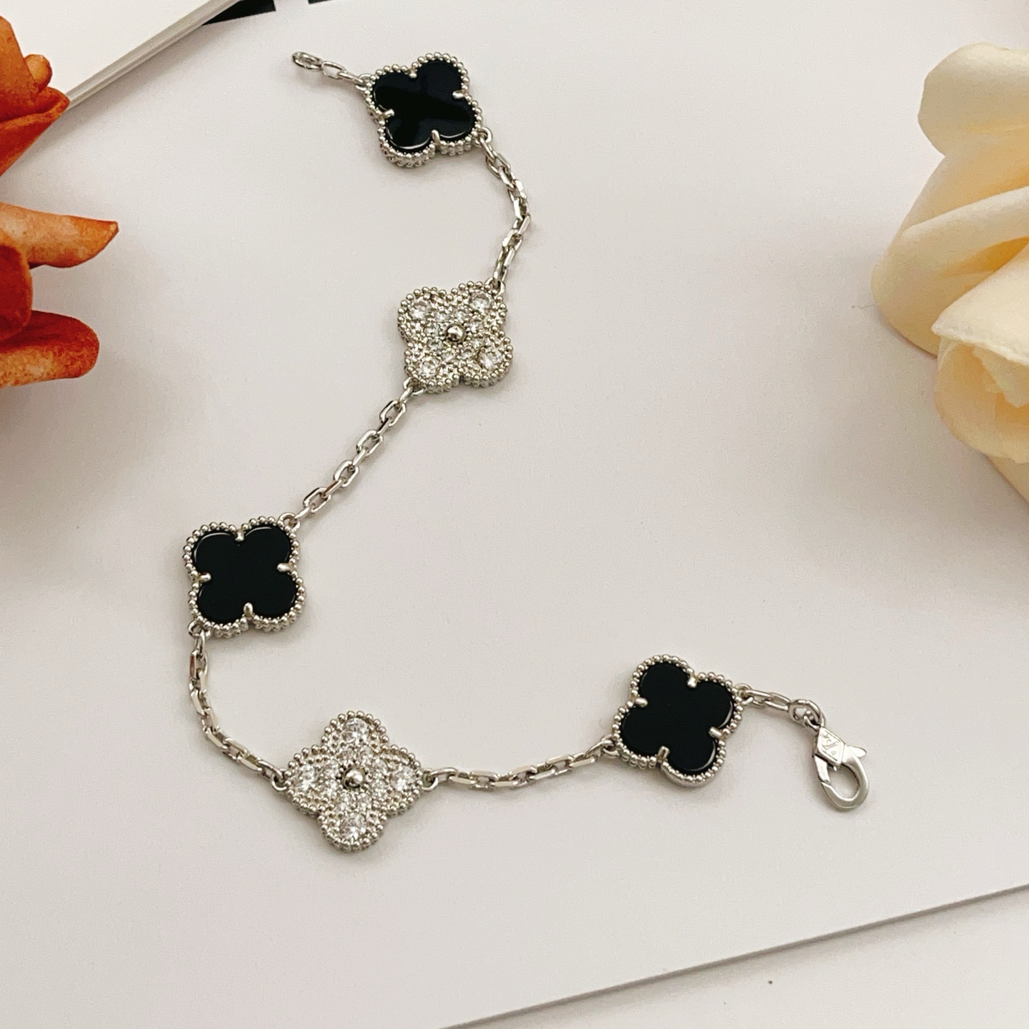 Van Cleef Arpels Alhambra bracelet Silver-toned white gold metal with black onyx and clear diamond accents 19cm