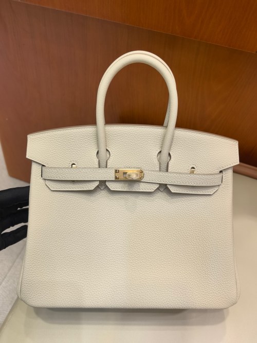 Hermès Birkin 25: Iconic Handbag in White Togo Leather with Gold Hardware 1 Hermès Birkin 25: Iconic Handbag in White Togo Leather with Gold Hardware