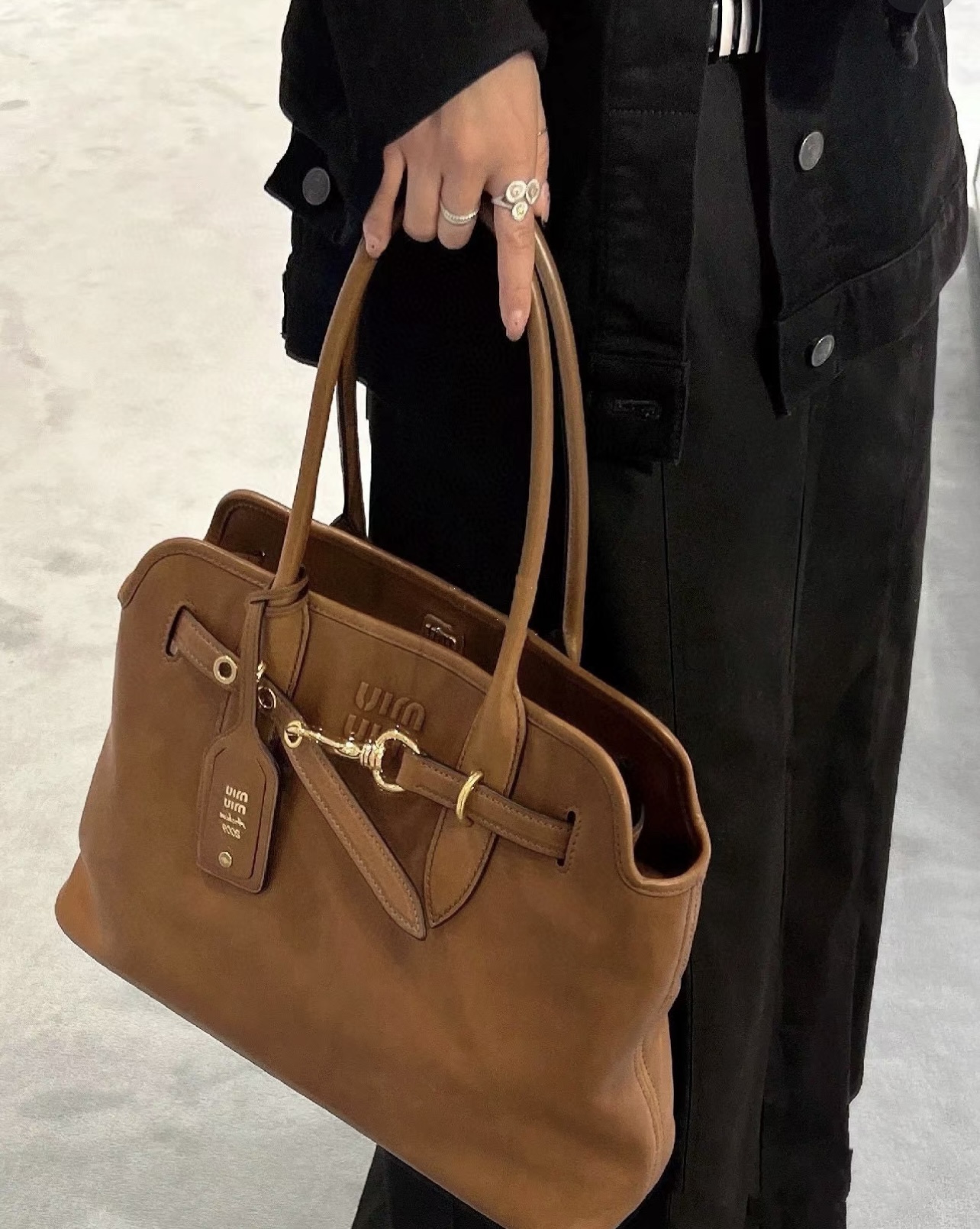 A classic tote bag designed with a softly structured silhouette, a - Comprehensive 5