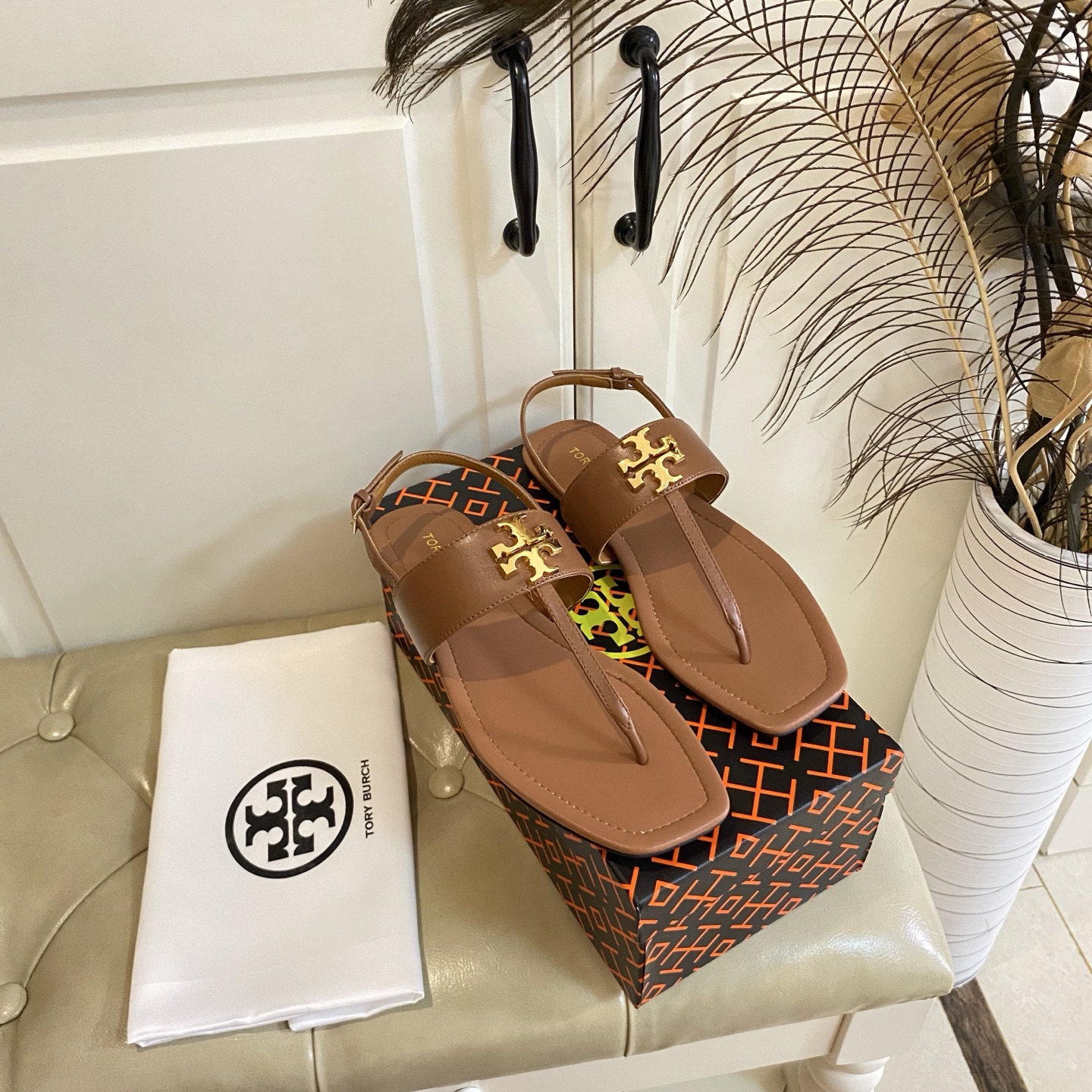 Tory Burch’s New Toe Sandals with Leather Base and Gold Buttons, Various Sizes Available.
