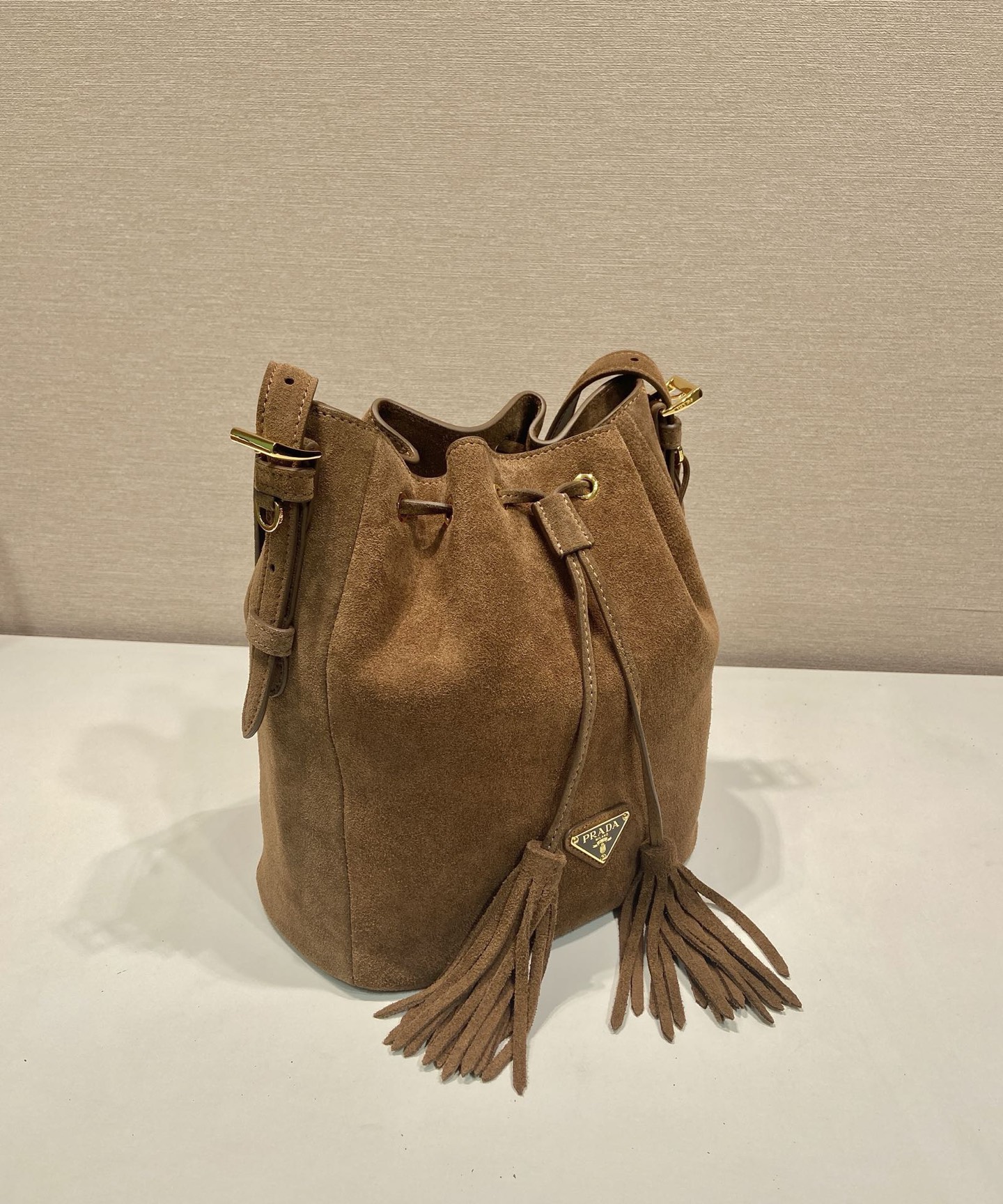 Prada Suede Bucket Bag with Tassel Drawstring Closure - Stylish & Versatile 3 i1756800120943 9160 0 2