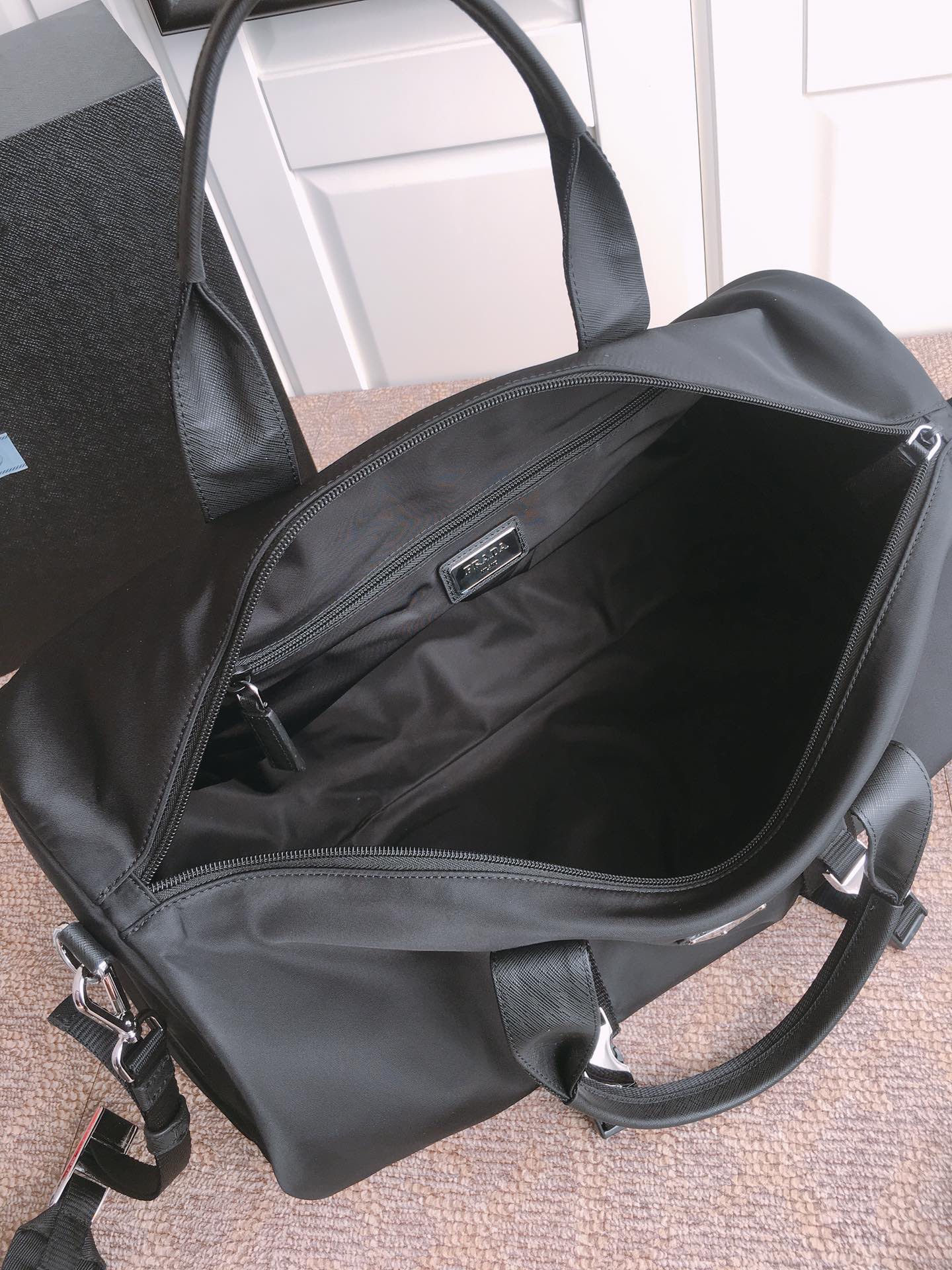 Prada Black Travel Bag with Signature Triangle Logo - Lightweight & Durable 9 i1756971921823 2154 0 7