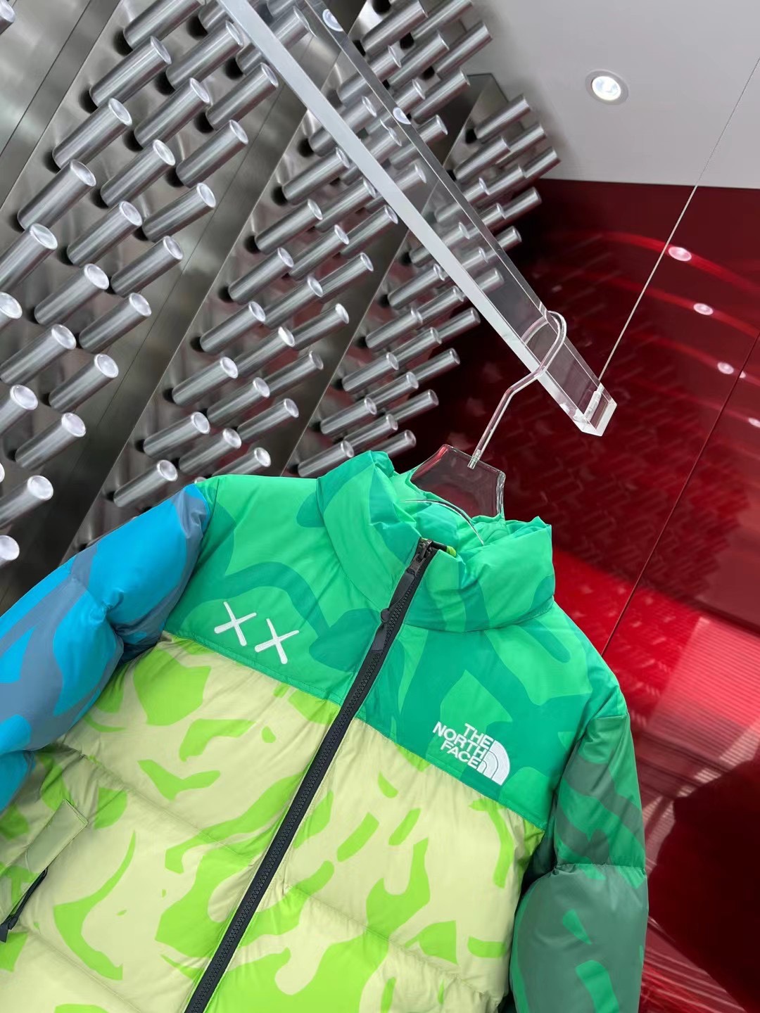 North Face x KAWS 1996 Nuptse jacket. New design with bold KAWS patterns and vibrant colors. Available in green and gray, sizes XS to XXL.-Big cat