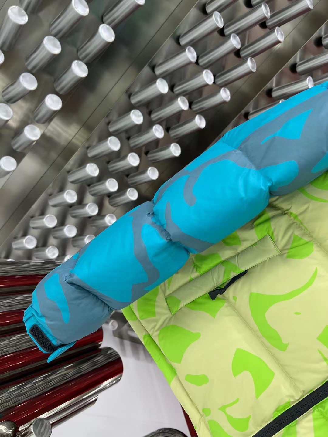 North Face x KAWS 1996 Nuptse jacket. New design with bold KAWS patterns and vibrant colors. Available in green and gray, sizes XS to XXL.-Big cat