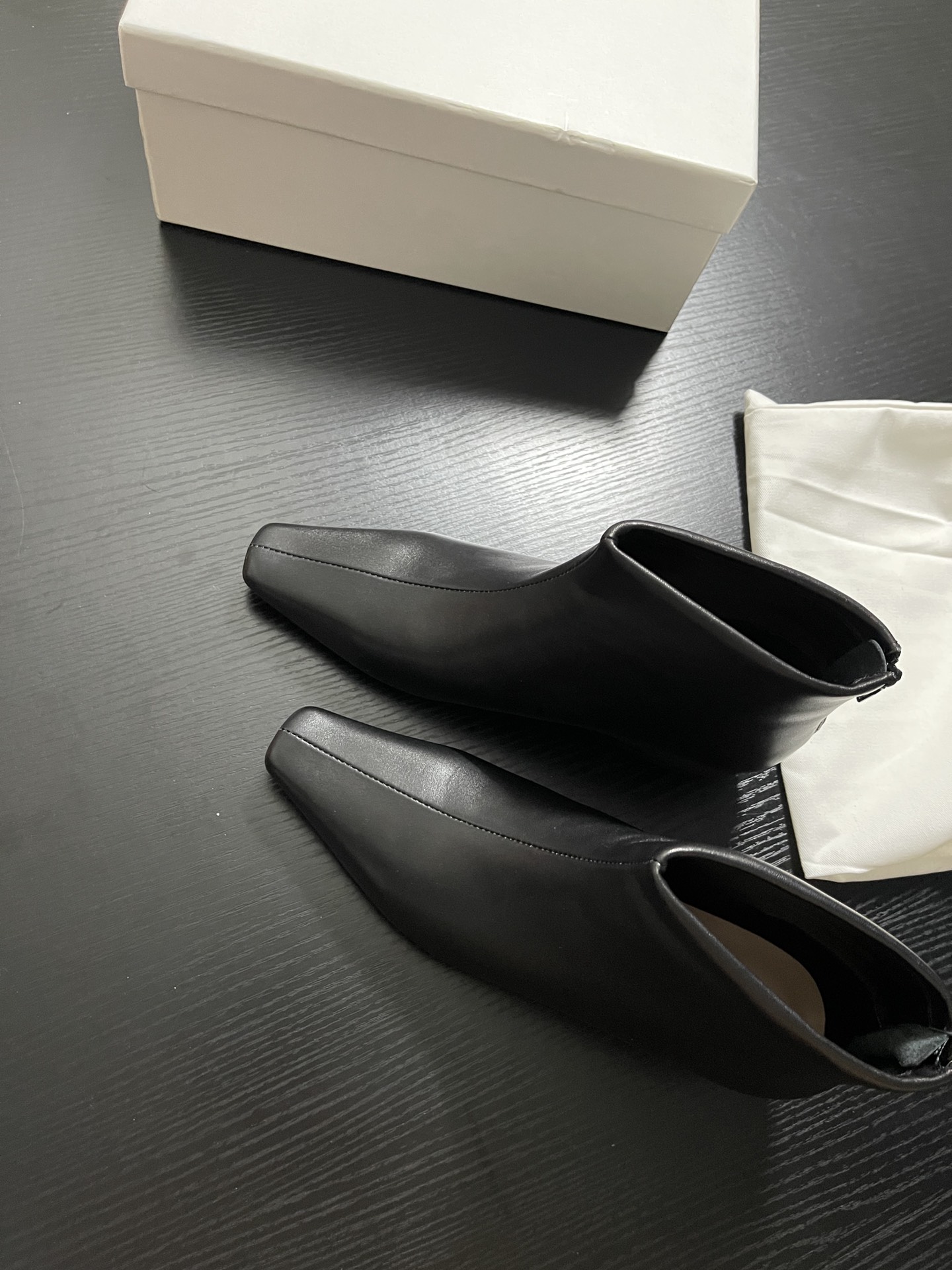 “Chelsea Short Boots: Sheepskin Coated Shoes with Pelt, Paint, and Flue Details”