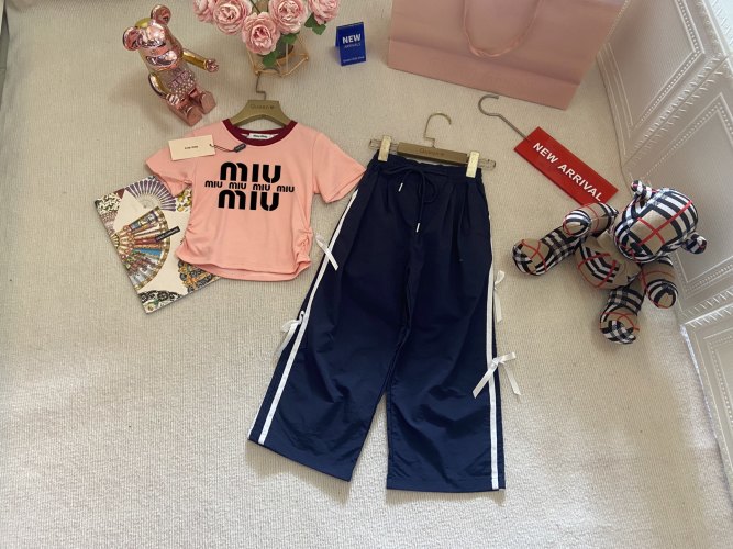 Miu Miu Kids Two-Piece Set: Drawstring Top & Bow Sport Pants - Spring Collection 1 Miu Miu Kids Two-Piece Set: Drawstring Top & Bow Sport Pants – Spring Collection