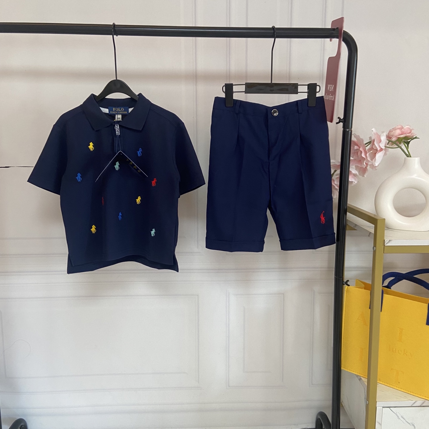 NO:769977,Kids’ exclusive real shot of Raf’s summer vitality ceiling!  Children's colorful horse Polo suit, refreshing and fashionable, mothers close their eyes and rush!  This Polo colorful horse suit directly brings the refreshing and childlike feeling of summer. It is very elegant for both boys and girls. It has good looks, comfort and practicality all online!  The colorful horse embroidery on the top is full of vitality. The milky white/navy blue Polo shirt has a clean and refreshing feeling, regardless of skin color, and makes the baby's skin white and tender!  Selected high-quality pique cotton fabric, breathable and not stuffy, soft and skin-friendly, will not irritate the baby when worn next to the body, and will not deform after long-term wear. Classic lapel + half placket design, neat and stylish, with a little gentleman's temperament, suitable for daily wear and school wear. Fully printed with colorful pony embroidery, the colors are bright and will not fade, full of childlike charm, instantly transform the baby into a street trendy person, and the number of repeat visits will be astonishing when going out on the street.  The loose fit fit does not restrict the baby from running and playing. The side slit design is more flexible and allows for stress-free movement. The bottoms are pure white/navy blue trousers, simple and high-end suit shorts, which perfectly echo the top. Wearing one set gives a high-end feel, no need to worry about matching!  Selected drape fabrics, crisp and wrinkle-free, breathable and skin-friendly, refreshing and not stuffy to wear in summer, easy to take care of. Button placket + waist design, fit the baby's body shape, easy to put on and take off, and can be easily controlled by fat and thin babies. The rolled hem design on the trousers adds a casual feel and full of details. The exquisite pony embroidery on the trousers is low-key and recognizable, echoing the colorful horse on the top, and the whole set is full of style.  Size 110-120-130-140-150--170cm, clothes, shorts, business suit,19860909Kids独家实拍拉夫夏日元气天花板！儿童彩马Polo套装,清爽又时髦 宝妈们闭眼冲！这套Polo彩马套装直接把夏日清爽感和童趣感拉满,男宝女宝穿都超显气质,颜值、舒适、实穿性全在线！ 上衣彩马刺绣,元气满满 奶白色/藏青色Polo衫,自带干净清爽感,不挑肤色,衬得宝宝皮肤白白嫩嫩！ 甄选优质珠地棉面料,透气不闷汗,软弹亲肤,宝宝贴身穿完全不刺激,久穿也不变形 经典翻领+半开襟设计,利落有型,自带小绅士气质,日常穿、上学穿都超合适 满印彩色小马刺绣,色彩鲜亮不褪色,童趣感拉满,瞬间让娃变身街头小潮人,出街回头率爆表 宽松合身的版型,不束缚宝宝跑跳玩耍,侧开叉设计更显灵动,活动无压力 下装纯白/藏青西裤,简约高级 西装短裤,和上衣完美呼应,一套穿出高级感,不用费心搭配！ 精选垂感面料,挺括不皱,透气亲肤,夏日穿清爽不闷,好打理不费心 纽扣门襟+腰头设计,贴合宝宝身形,穿脱方便,胖瘦宝宝都能轻松驾驭 裤脚卷边设计,增添休闲感,细节感拉满 裤身精致小马刺绣,低调又有辨识度,和上衣彩马形成呼应,整套造型感拉满 码数110-120-130-140-150--170cm,衣服,shorts,business suit,,Children's