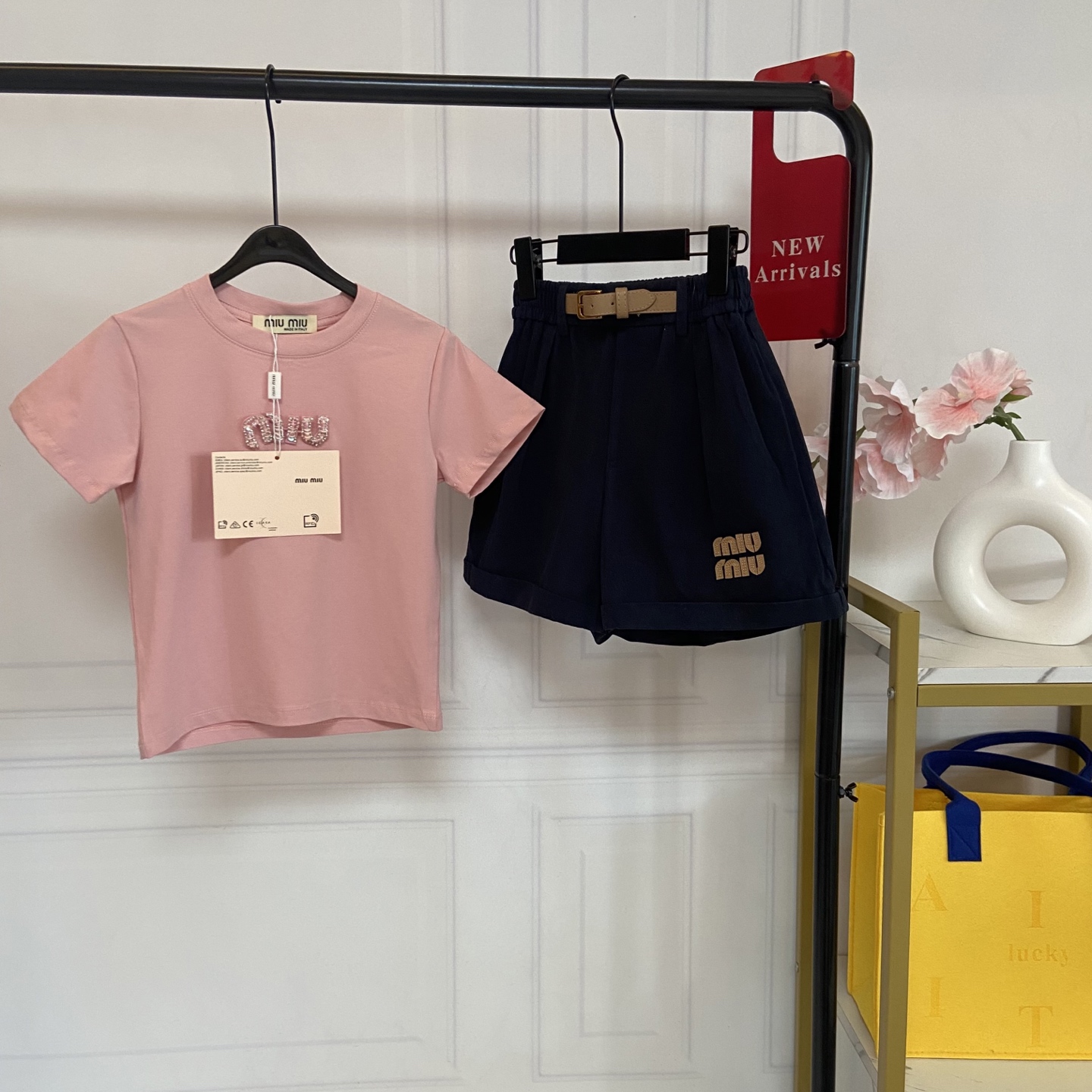 NO:850363,Kids' exclusive real-life photo of girls' MiuMiu pink T-shirt + navy shorts set [Sakura pink short-sleeved T-shirt · Highlights of details] 1. Category A mother-and-child grade fabric, as soft as clouds against the skin. Made of high-count combed cotton fabric, no fluorescent agent, no formaldehyde, and babies with sensitive skin can wear it with confidence. It feels soft and skin-friendly, absorbs sweat and is breathable without stuffiness. In summer, after children play wildly all afternoon, the back will be refreshing and not sticky, saying goodbye to redness, itching, and sweating worries.  2. Genki Sakura Powder, gentle and whitening without picking at skin. Low saturation Sakura Powder, gentle and eye-catching, with a built-in filter effect, whitening the upper body and looking complexion, easily wearing a cute and sweet girl look, no longer afraid of children wearing dark colors to look old and wearing light colors to look dark!  3. Comfortable fit, easy to put on and take off regardless of figure. The classic round neck design does not block the neck or restrict the head, so children can easily put on and take off by themselves; the fit is slightly loose, not tight or bloated, and can hide belly fat and fat, and can be easily controlled by fat and thin babies. 4. Exquisite rhinestone logo, low-key and noble.  The chest is decorated with MiuMiu Feng rhinestone letters. The blingbling is super exquisite. It does not snag or drop diamonds. It is not exaggerated for daily wear and looks high-end when worn at parties. The wiring is neat and firm and will not fall off easily after multiple machine washes. [Navy blue high-waisted A-line shorts · Highlights of details] 1. High-waisted version, slim and stylish  The high-waisted A-line cut perfectly modifies the waist, abdomen and leg shape, hides the belly and fake hip width, and changes the proportion of 30 to 70 in seconds. It can be easily controlled by fat and thin babies. It is not tight or bloated and looks great in photos. 2. Elastic waistband + belt design, comfortable and not tight on the belly.  The waist is designed with elasticity and is matched with a decorative belt, which does not tighten the belly or the waist. The child will not feel uncomfortable after eating. It is easy to put on and take off without picking the waistline. Daily activities are not restricted, and you can run, jump and play freely. 3. Anti-wrinkle drape fabric, which will not deform after long-term wear. It is made of stiff and anti-wrinkle fabric, which is not easy to pill or deform. It can still be crisp and stylish even after repeated washing. The navy blue color is stain-resistant and versatile. It looks good with T-shirts, sweatshirts and shirts, and can be worn all year round.  4. Exquisite embroidered logo, full of details. The MiuMiu style embroidered letters on the trouser legs are neatly and firmly routed, low-key and recognizable, echoing the top, making the overall match more coordinated, and easily wearing the same texture as the big brands. Size---130-140-150-160cm, clothes, miumiu, hoodie, sweatshirts, shorts, shirts, T-shirt, tees, t-shirt,19860909Kids独家实拍女童MiuMiu风粉T恤+藏青短裤套装 【樱花粉短袖T恤 · 细节亮点】 1. A类母婴级面料,软到像云朵贴肤 采用高支精梳棉面料,无荧光剂、无甲醛,敏感肌宝宝也能放心穿.触感软糯亲肤,吸汗透气不闷汗,夏天孩子疯玩一下午,后背也清爽不黏腻,告别红痒闷汗烦恼. 2. 元气樱花粉,温柔显白不挑皮 低饱和樱花粉,温柔又亮眼,自带滤镜感,上身巨显白显气色,轻松穿出软萌甜妹感,再也不怕孩子穿深色显老、穿浅色显黑！ 3. 舒适版型,不挑身材好穿脱 经典圆领设计,不卡脖子、不勒头,孩子自己就能轻松穿脱；合身微宽松版型,不紧绷、不臃肿,藏住小肚腩、拜拜肉,胖瘦宝宝都能轻松驾驭. 4. 精致水钻logo,低调又显贵 胸口MiuMiu风水钻字母装饰,blingbling超精致,不勾丝、不掉钻,日常穿不夸张,聚会穿又显高级,走线工整牢固,多次机洗也不易脱落.【藏青高腰A字短裤 · 细节亮点】 1. 高腰版型,显瘦藏肉超有型 高腰A字剪裁,完美修饰腰腹和腿型,藏住小肚腩、假胯宽,穿上秒变三七分比例,胖瘦宝宝都能轻松驾驭,不紧绷、不臃肿,拍照上镜超好看. 2. 弹力腰头+腰带设计,舒适不勒肚 腰头做了弹力松紧设计,搭配装饰腰带,不勒肚子、不勒腰,孩子吃撑了也不难受,穿脱轻松,不挑腰围,日常活动无束缚,跑跳玩耍都自在. 3. 抗皱垂感面料,久穿不变形 采用挺括抗皱面料,不易起球、不易变形,多次清洗也依然挺括有型,藏青色耐脏百搭,搭配T恤、卫衣、衬衫都好看,一年四季都能穿. 4. 精致刺绣logo,细节拉满 裤腿处MiuMiu风刺绣字母,走线工整牢固,低调又有辨识度,和上衣形成呼应,整体搭配更协调,轻松穿出大牌同款质感. 码数---130-140-150-160cm,衣服,miumiu,hoodie,sweatshirts,shorts,shirts,T-shirt,tees，t-shirt,,Children's