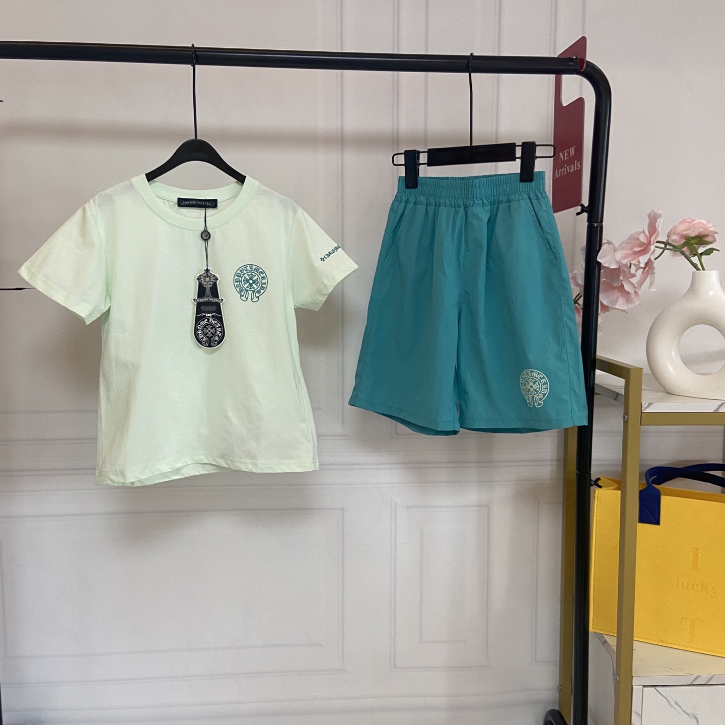 NO:850261,Kids’ exclusive real-shot Chrome Hearts mint green suit [mint green gradient short-sleeved T-shirt · Highlights of details] 1. Class A maternal and child-grade fabric, skin-friendly, breathable and not sweaty. Made of high-count combed cotton fabric, no fluorescent agent, no formaldehyde, babies with sensitive skin can rest assured to wear it. It feels soft and delicate, absorbs sweat, is breathable and non-sticky. Even if the children play wildly all afternoon in summer, the back will still be fresh and not sweaty. Say goodbye to the trouble of redness, itching and sweating. 2.  The mint green gradient design is refreshing and whitening without picking up the skin. The low saturation mint green comes with a cooling filter, which is gentle and eye-catching. It makes the upper body whiter and brighter, and can easily wear a refreshing and youthful look. You no longer have to worry about children wearing dark colors to look stuffy and wearing light colors to look dark!  3. Comfortable fit, easy to put on and take off regardless of body shape. The classic round neck design does not block the neck or restrict the head, so children can easily put on and take off by themselves; the fit is slightly loose, not tight, not bloated, and can hide the belly. It can be easily controlled by fat and thin babies. It can be worn in daily wear without choosing a match. It looks handsome no matter how you wear it. 4. Cool cross print, low-key and recognizable. Chest + cuffs Chrome  Hearts style cross print, with neat and firm lines, no snagging or fading, no exaggeration for daily wear, and trendy and cool for party wear. It has a sense of high-end and can easily be worn with the same texture as the famous brand. [Lake blue casual shorts · Highlights in details] 1. Drape anti-wrinkle fabric, refreshing and breathable without stuffing the legs.  It is made of smooth and breathable woven fabric, which is light and not sweaty to the touch. It is not easy to pill or deform. It remains crisp and stylish even after repeated washing. The lake blue color is refreshing and versatile. It looks good with T-shirts and sweaters. It can be worn all year round and has a high utilization rate. 2. Loose and straight fit, which hides the flesh and makes you look slimmer and more stylish.  The loose straight cut perfectly modifies the leg shape. It is not tight or constricting the legs. Children can run, jump and play without restraint. It hides the fake wide hips and small thick legs. It instantly transforms into a neat and trendy boy when put on. It looks great in photos. 3. Elastic waistband design, comfortable and not constricting the belly.  The waistband is designed with elastic elasticity and is decorated with open threads. It does not tighten the tummy or the waist, and the child will not feel uncomfortable after eating. It is easy to put on and take off, and does not pick up the waistline. Daily activities are not restricted, and you can run, jump and play freely. 4. The same series of cross prints, full of details. The Chrome Hearts style cross print on the trouser legs echoes the top print, making the overall match more coordinated, full of details, neat and firm wiring, not easy to fall off, and easy to wear for a trendy and cool boyish look.  Size---150-160-170cm, clothes, chrome hearts, hoodie, sweatshirts, shorts, T-shirt, tees, t-shirt,19860909Kids独家实拍Chrome Hearts薄荷绿套装【薄荷绿渐变短袖T恤 · 细节亮点】 1. A类母婴级面料,亲肤透气不闷汗 采用高支精梳棉面料,无荧光剂、无甲醛,敏感肌宝宝也能放心贴肤穿.触感软糯细腻,吸汗透气不黏腻,夏天孩子疯玩一下午,后背依然清爽不闷汗,告别红痒闷汗烦恼. 2. 薄荷绿渐变设计,清爽显白不挑皮 低饱和薄荷绿自带降温滤镜,温柔又亮眼,上身巨显白显气色,轻松穿出清爽少年感,再也不怕孩子穿深色显闷、穿浅色显黑！ 3. 舒适版型,不挑身材好穿脱 经典圆领设计,不卡脖子、不勒头,孩子自己就能轻松穿脱；合身微宽松版型,不紧绷、不臃肿,藏住小肚腩,胖瘦宝宝都能轻松驾驭,日常穿不挑搭配,怎么穿都帅气. 4. 潮酷十字印花,低调有辨识度 胸口+袖口Chrome Hearts风十字印花,走线工整牢固,不勾丝、不掉色,日常穿不夸张,聚会穿又显潮酷,自带高级感,轻松穿出大牌同款质感.【湖蓝色休闲短裤 · 细节亮点】 1. 垂坠抗皱面料,清爽透气不闷腿 采用顺滑透气的梭织面料,触感轻薄不闷汗,不易起球、不易变形,多次清洗也依然挺括有型,湖蓝色清爽百搭,搭配T恤、卫衣都好看,一年四季都能穿,利用率超高. 2. 宽松直筒版型,藏肉显瘦超有型 宽松直筒剪裁,完美修饰腿型,不紧绷、不勒腿,孩子跑跳玩耍无束缚,藏住假胯宽、小粗腿,穿上秒变利落小潮男,拍照上镜超好看. 3. 弹力腰头设计,舒适不勒肚 腰头采用弹力松紧设计,搭配明线装饰,不勒肚子、不勒腰,孩子吃撑了也不难受,穿脱轻松,不挑腰围,日常活动无束缚,跑跳玩耍都自在. 4. 同系列十字印花,细节拉满 裤腿处Chrome Hearts风十字印花,和上衣印花形成呼应,整体搭配更协调,细节感满满,走线工整牢固,不易脱落,轻松穿出潮酷少年感. 码数---150-160-170cm,衣服,chrome hearts,hoodie,sweatshirts,shorts,T-shirt,tees，t-shirt,,Children's