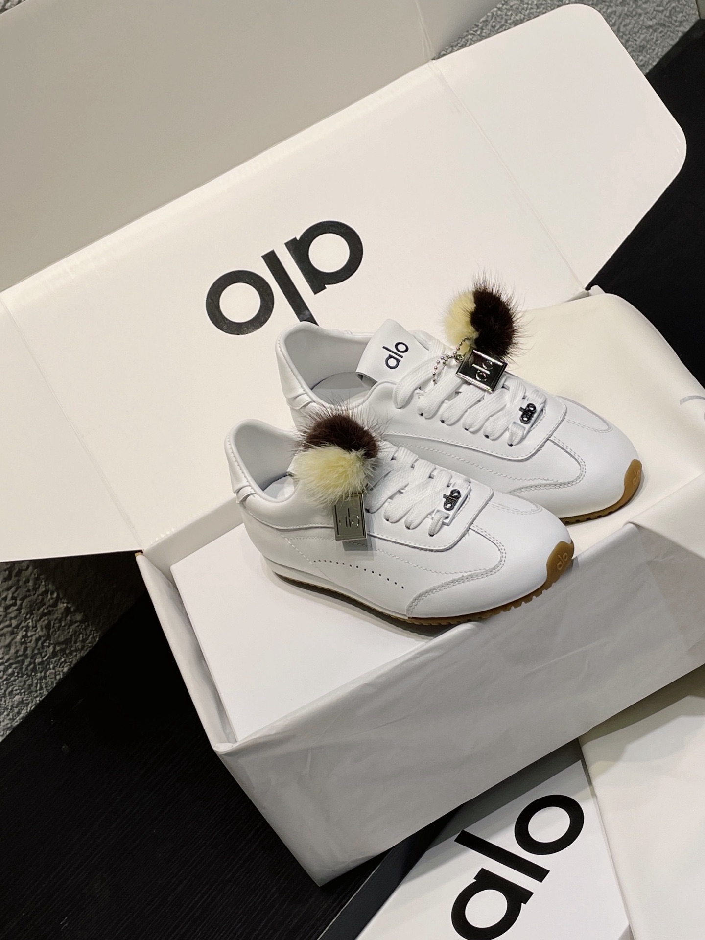 ALO Yoga Women's White Leather Trainers with Fur Pom-Pom Charm Sneakers