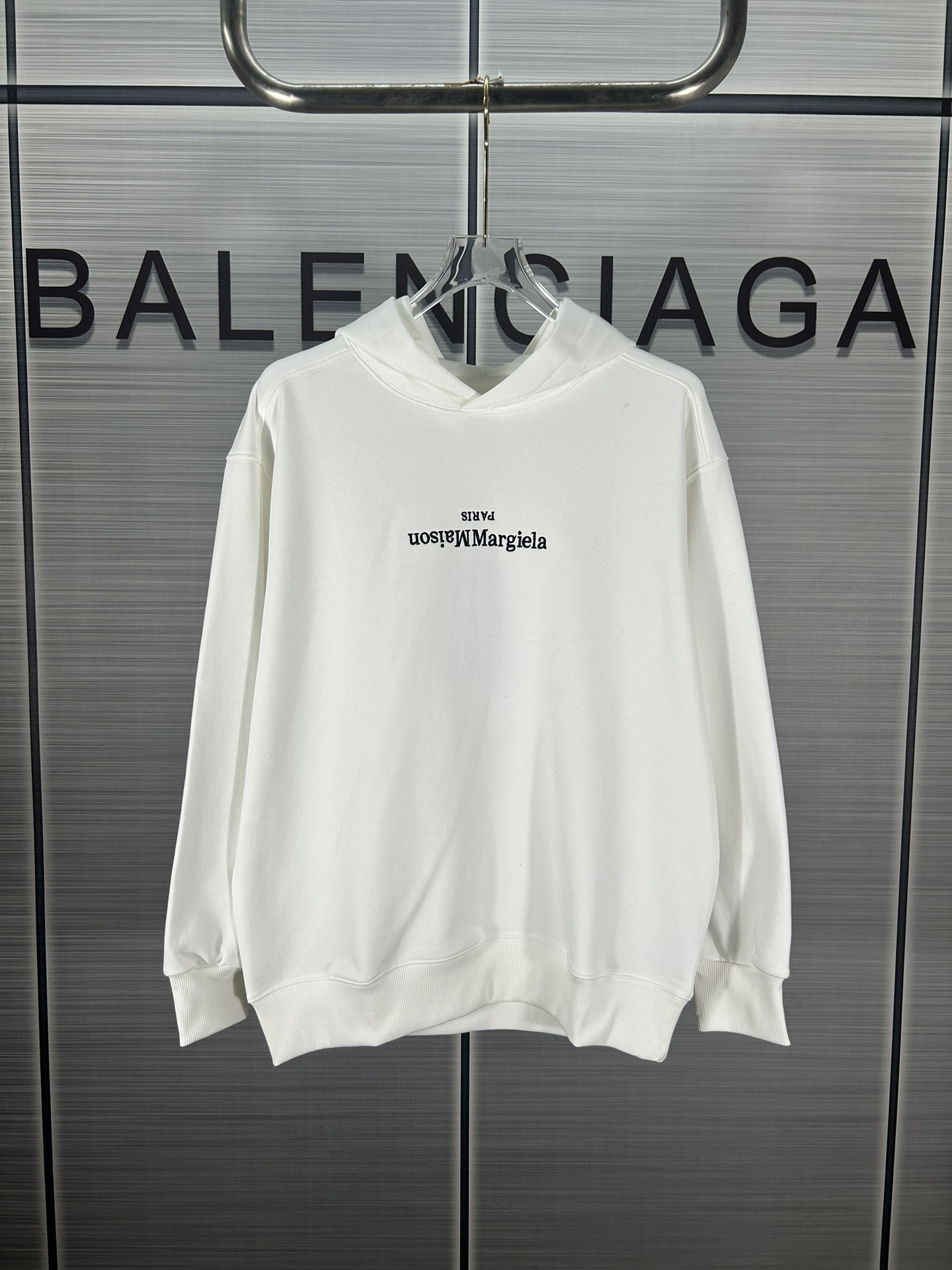 Maison Margiela 2024 Collection: Heavy Embroidered Coats and Hats in Black/White.