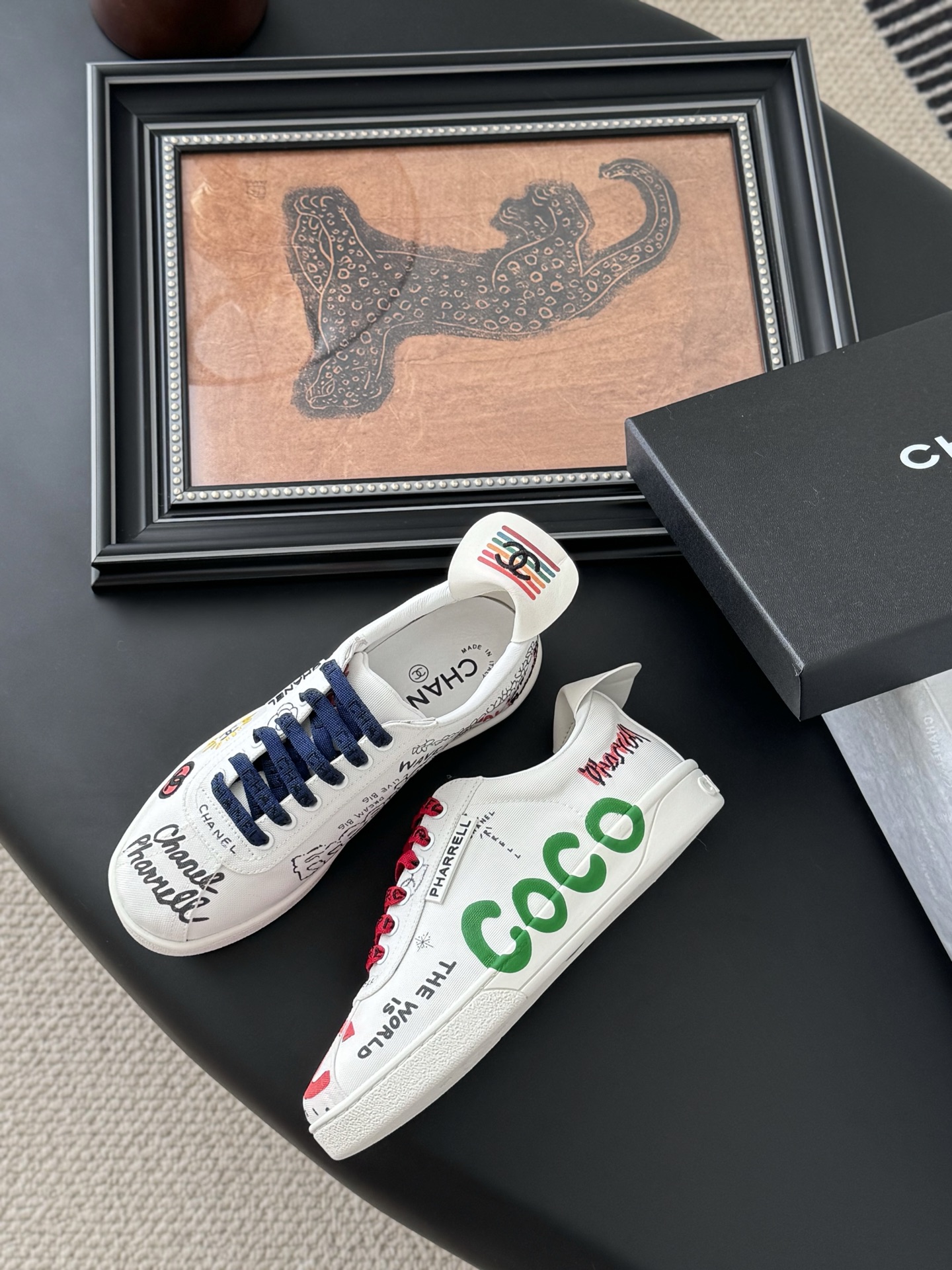 Chanel Graffiti Print Lace-Up Sneakers. Iconic, Stylish, and Comfortable.