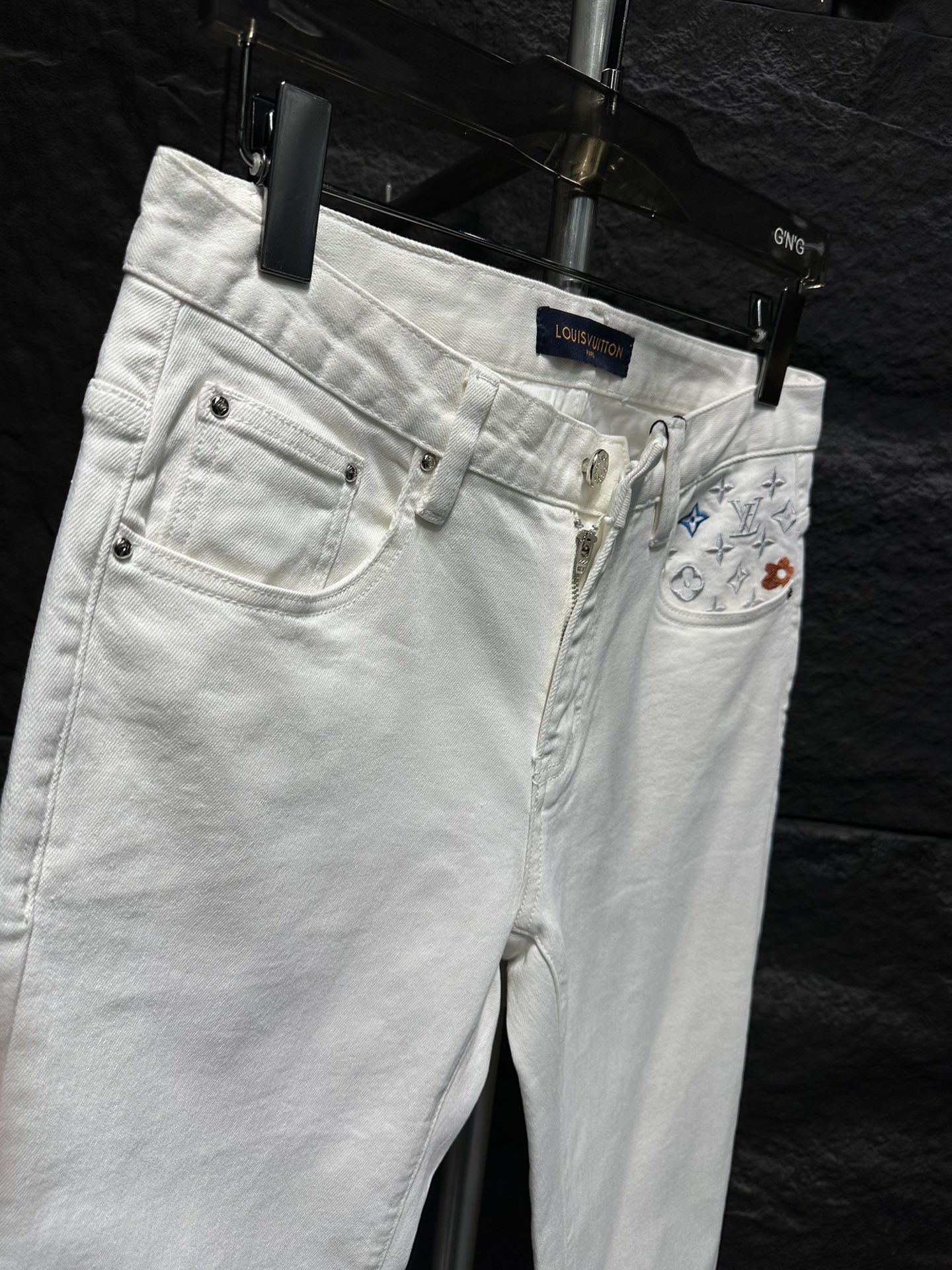 Louis Vuitton: Stylish White Jeans with Signature Monogram Pocket Detail 6 i1746175691 9323 6