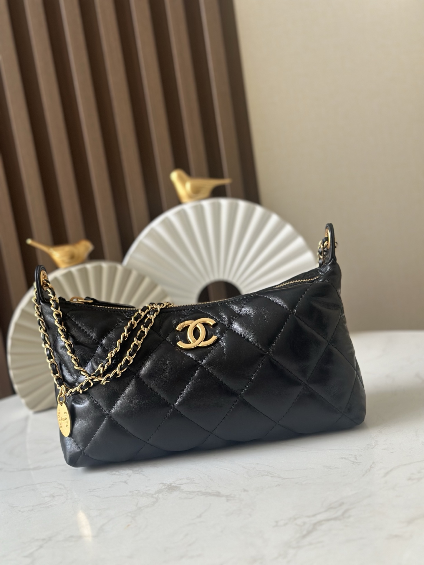 Chanel Style Black Leather Hobo Bag style reference detail image 1 from source 776542