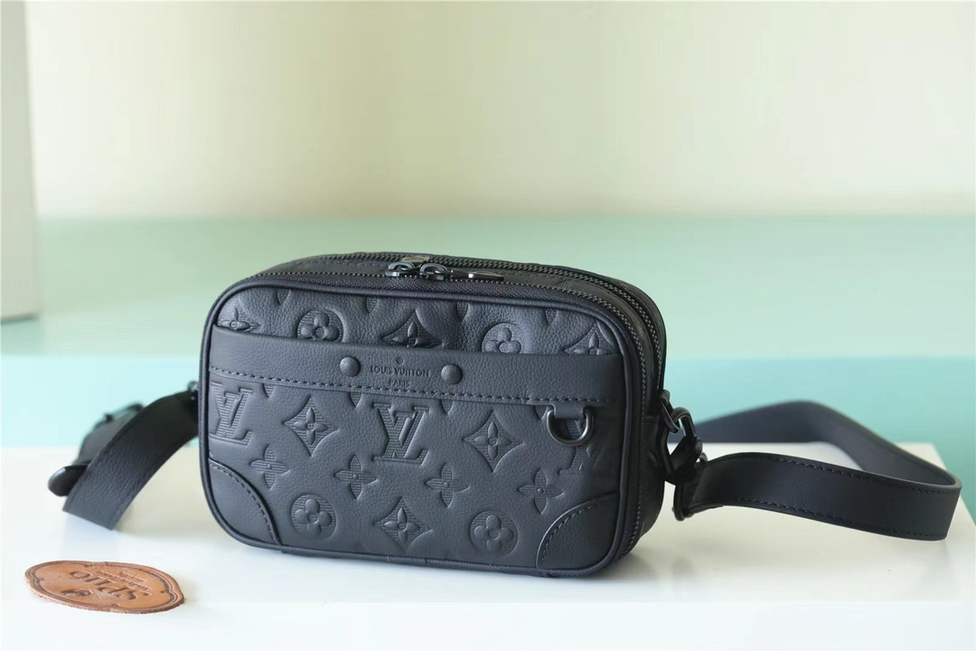 Its spacious interior features a zipped compartment and a front flat - Bag