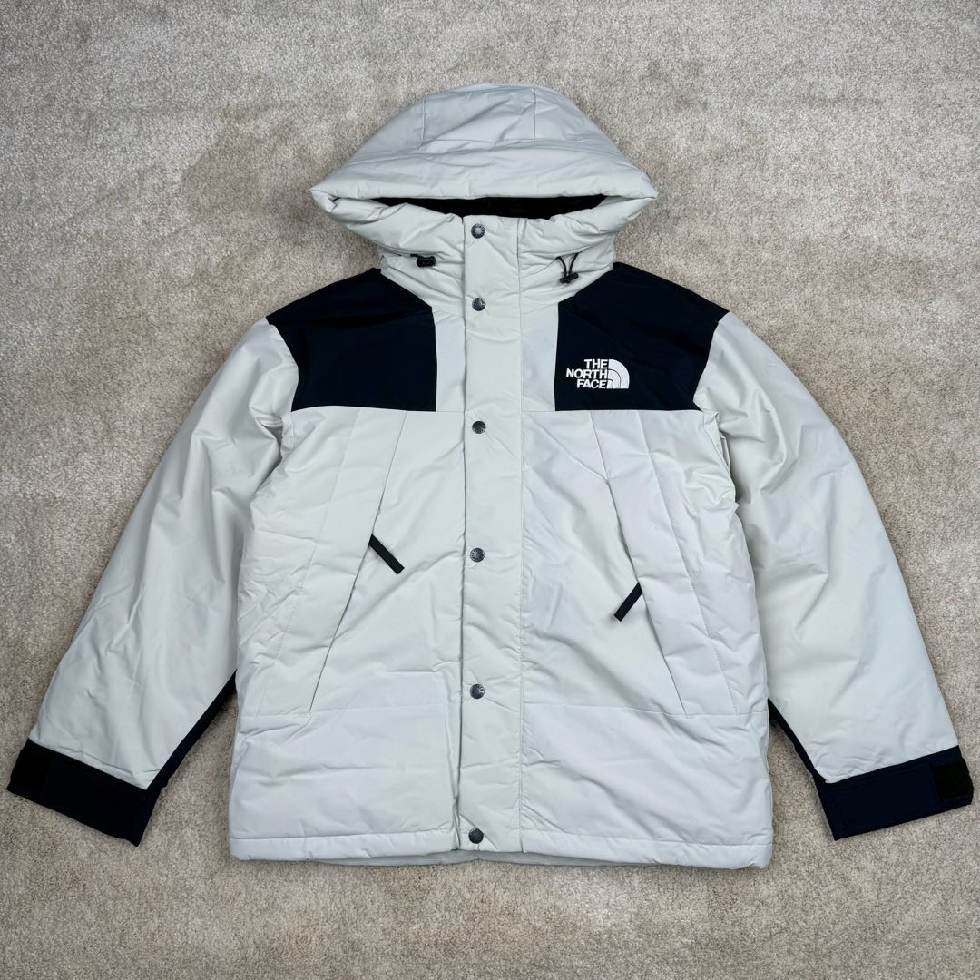 THE NORTH FACE Mountain FW24 Gore-Tex dryvent ULTIMATE 北面山脉系列防水面料刺绣LOGO防风保暖鹅绒连帽含羽绒外套男女同款 The North Face于1966年成立，一直致力于为户外运动员的每一次严酷探索提供专业装备。作为全球户外运动领导品牌，The NorthFace以经过专业运动员测试、适应各类户外需求的产品助力探索者不断超越自我，激发人类潜能。The North Face象征着众多山脉中更冷、更值得挑战的北坡。品牌标志则来自Half Dome，一座位于美国加州Yosemite NationalPark（优胜美地国家公园）里的山峰，中文名字取为「北面」，象征着不畏惧的户外探索精神。1997年，The North Face采用全新的宣传标语「Never Stop Exploring探索永不停止」，体现品牌的探索精神，成为品牌的座右铭。尺码：XS S M L XL 2XL-选品中心