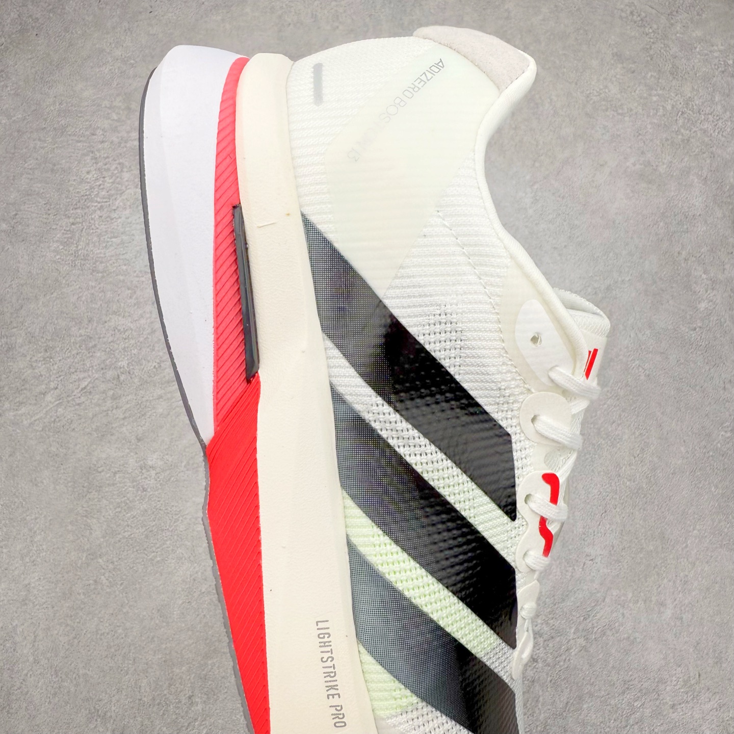 图片[6]-AD Adizero Boston 13 夏季透气网眼竞速跑鞋 JS4934 融合Lightstrike和Lightstrike Pro技术 采用乙烯/乙酸乙烯酯(EVA)材质 打造舒适中底 含ENERGYROD能量碳柱 旨在为步伐添活力 尺码：36 36.5 37 38 38.5 39 40 40.5 41 42 42.5 43 44 44.5 45-选品中心