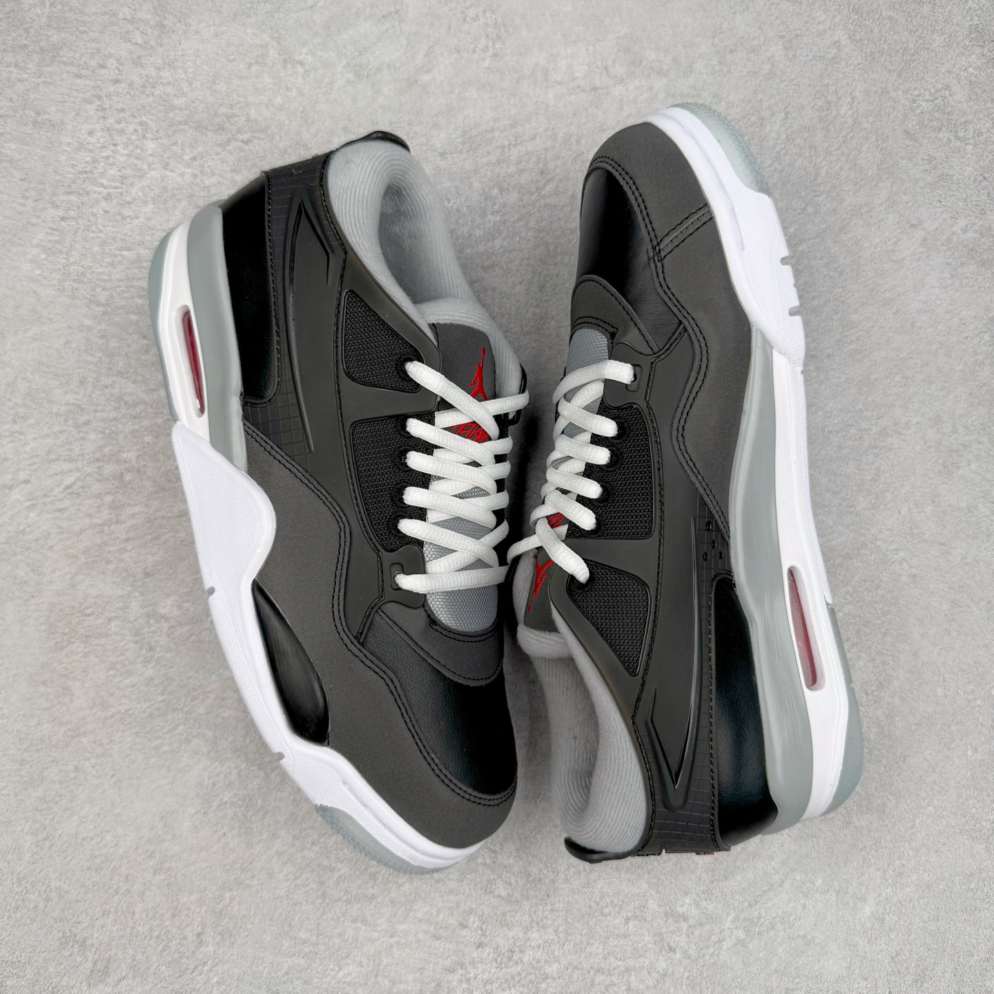 图片[3]-＃KZ纯原 Air Jordan AJ4 RM 重制版低帮复古篮球鞋 黑色 HV5184-010 亲自操刀耗时半年巨作 全套原纸板楦头开发 确保原汁原味 完美呈现版型 一比一鞋头弧度高度鞋身弧度 原厂TPU 正确内里网布 菱角分明不变形无多余毛边 柔软性质感一致于原鞋 原厂织唛标 原厂飞人电绣工艺 尾指中部跳三针 独家绑鞋带手法 印刷中底布 四线拉帮 米色美纹纸贴合固定 进口港宝加持 后跟自然饱满 全鞋荧光划线卡点 追求极致完美 每一双都是工艺品 多重QC质检 超越公司货的品控标准 实实在在的免检产品 采用了低帮的设计 并保留了众多AJ4的经典元素 鞋身以皮革、麂皮材质拼接打造 AJ4经典的TPU材质延伸至后跟 增强鞋款稳定性 而鞋身侧面的网格设计则被取消 尾部的NIKE AIR标志也得到保留 并同时带有飞人logo 中底部分同样搭载了可视AIR气垫 鞋底采用米白色中底和外底呈现 为整个设计收尾 尺码：36 36.5 37.5 38 38.5 39 40 40.5 41 42 42.5 43 44 44.5 45 46 47.5-选品中心