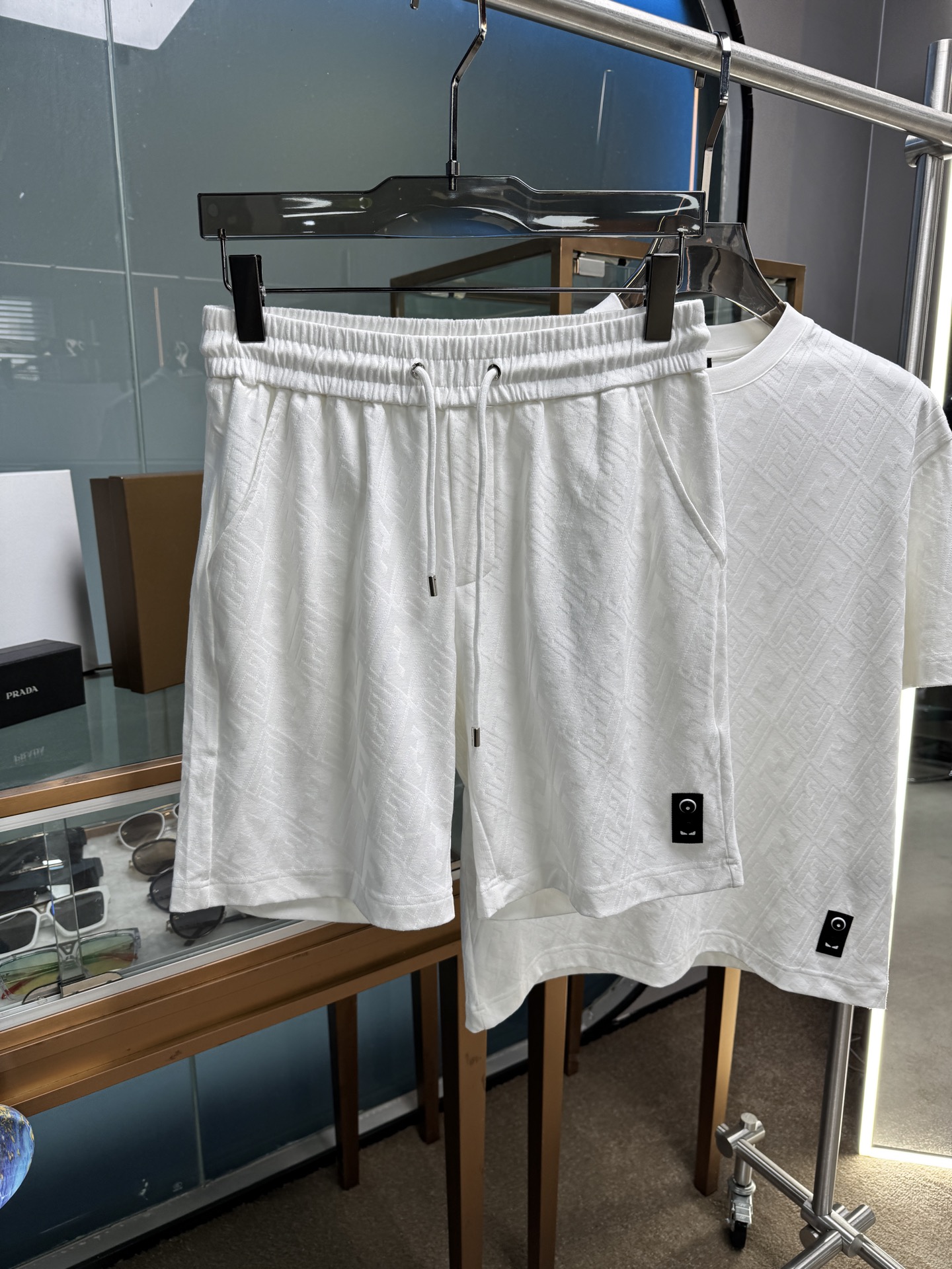 “Fendi SS21 Cotton Suit Collection: Top Hardware, Fabric, and Floral Design in Black and White for Men and Women”