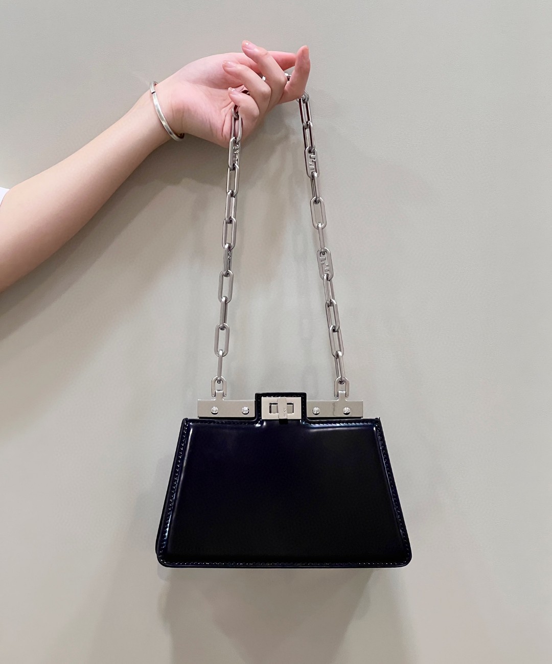 Peekaboo Cut Petite Italian box calfskin, this unconventional interpretation of Fendi's moving cross-cut design