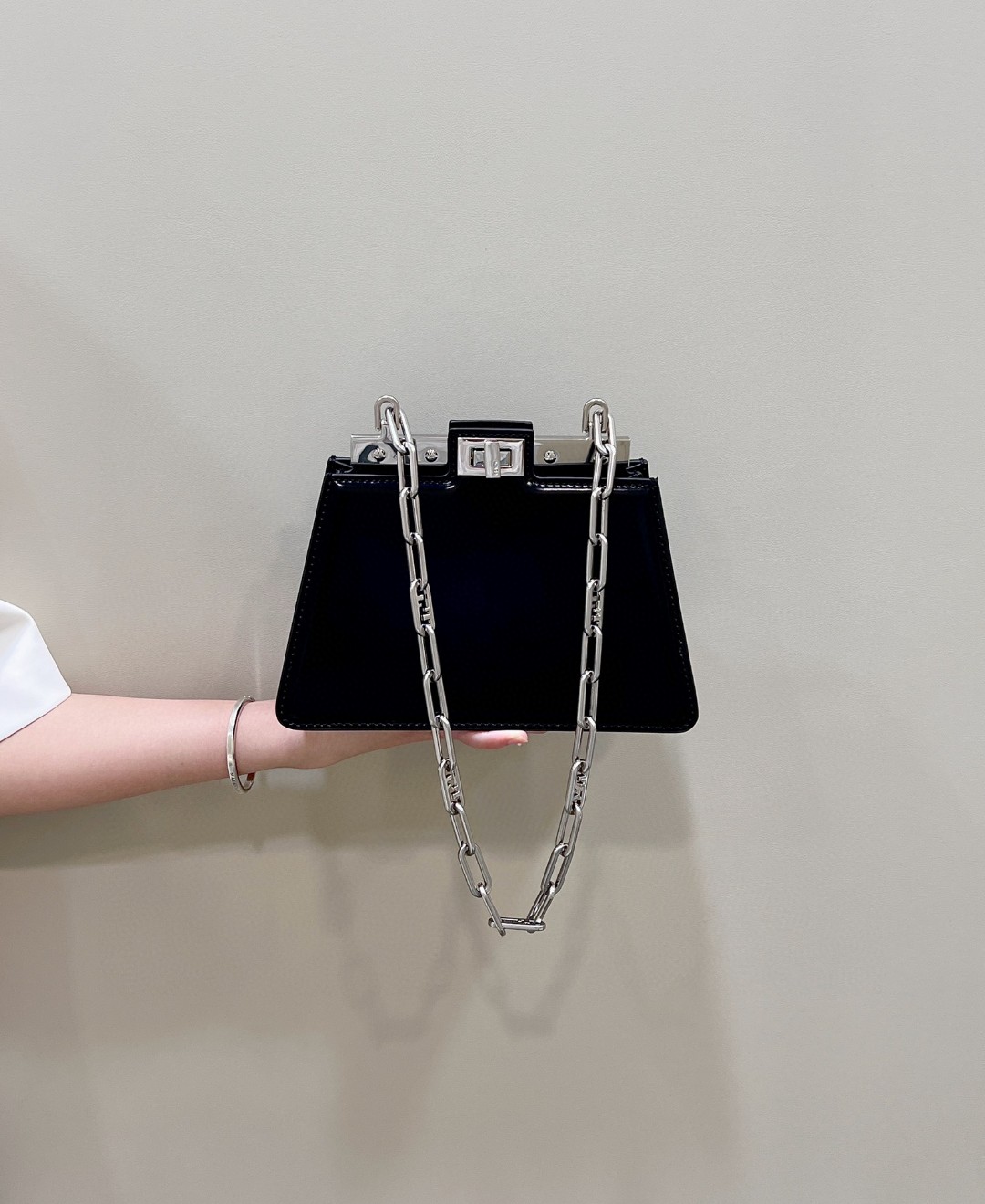 Peekaboo Cut Petite Italian box calfskin, this unconventional interpretation of Fendi's moving cross-cut design