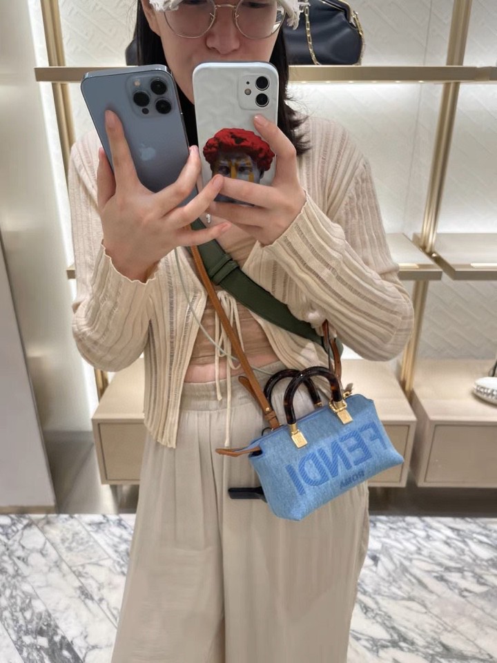 Fend1 Iconic By The Way Boston mini bag in light blue denim, made of light blue denim, decorated with FENDI ROMA embroidery in the same color and