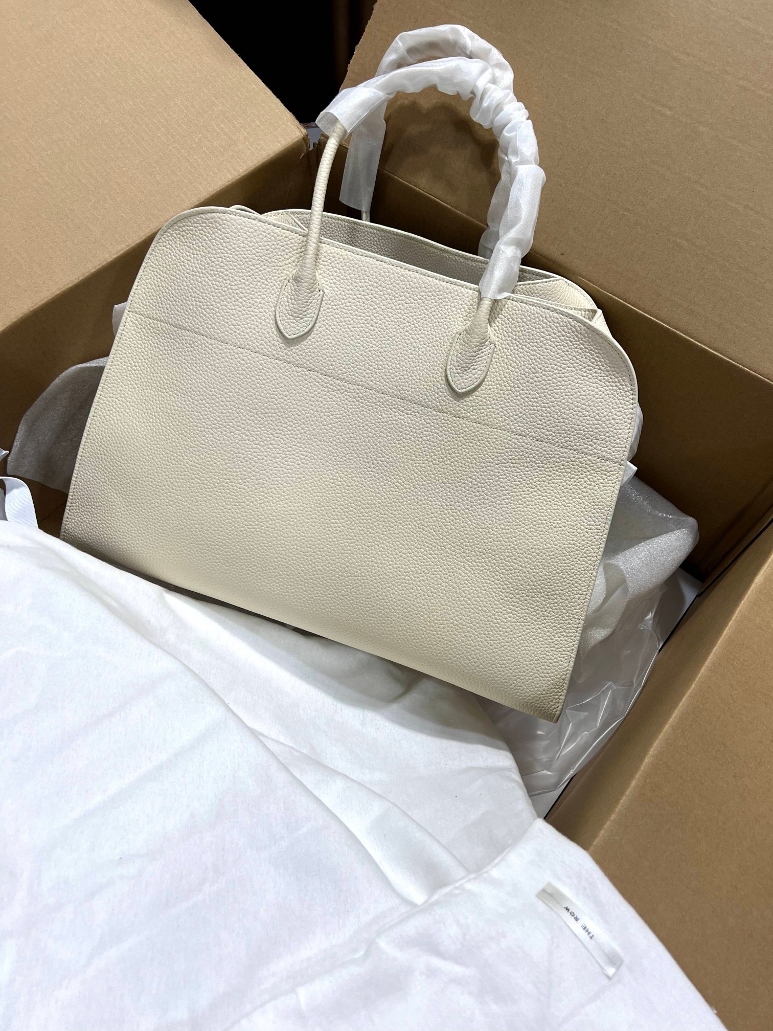 The Row This bag has a large boxshipping fee 30