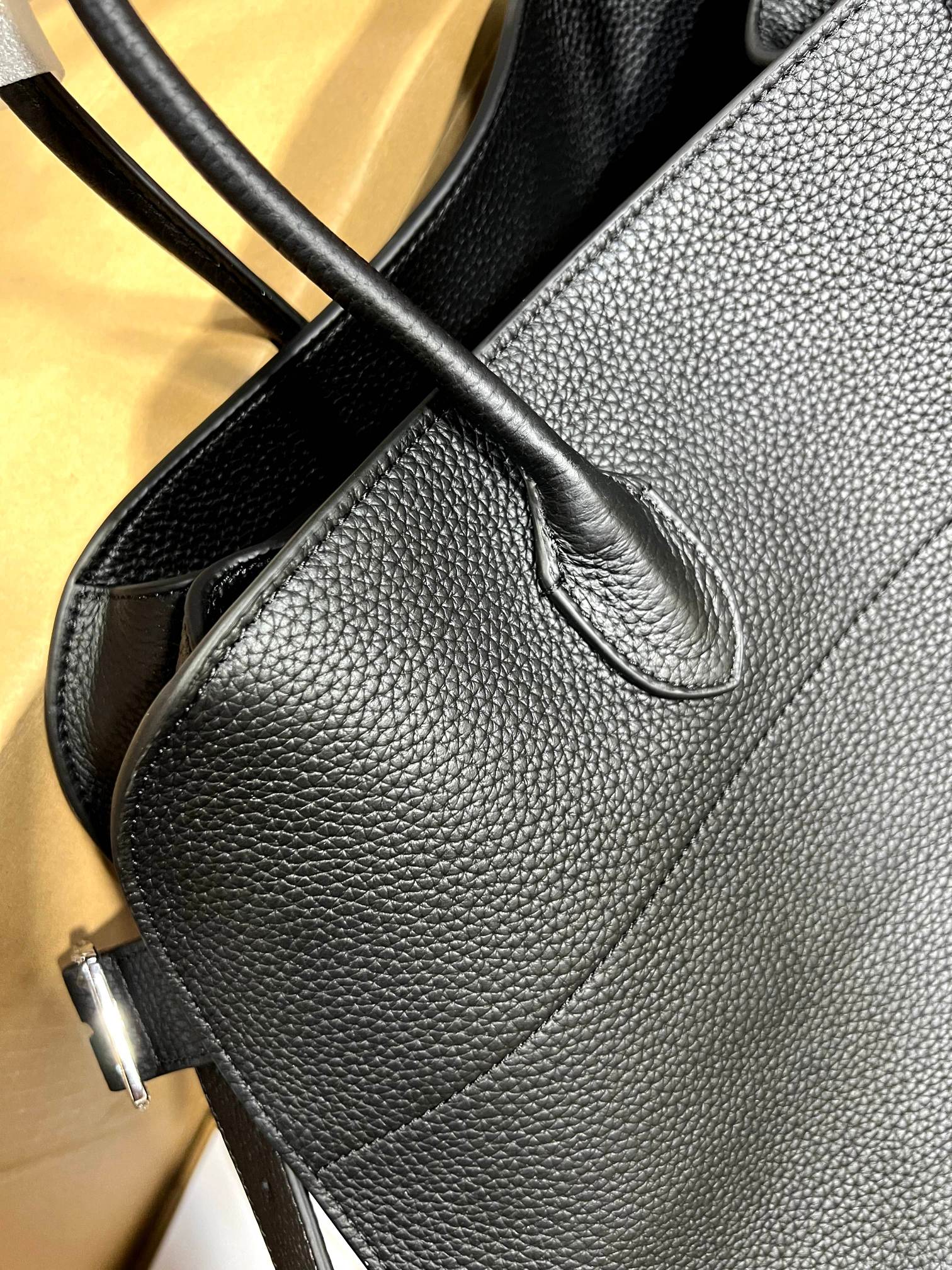 The Row This bag has a large boxshipping fee 30