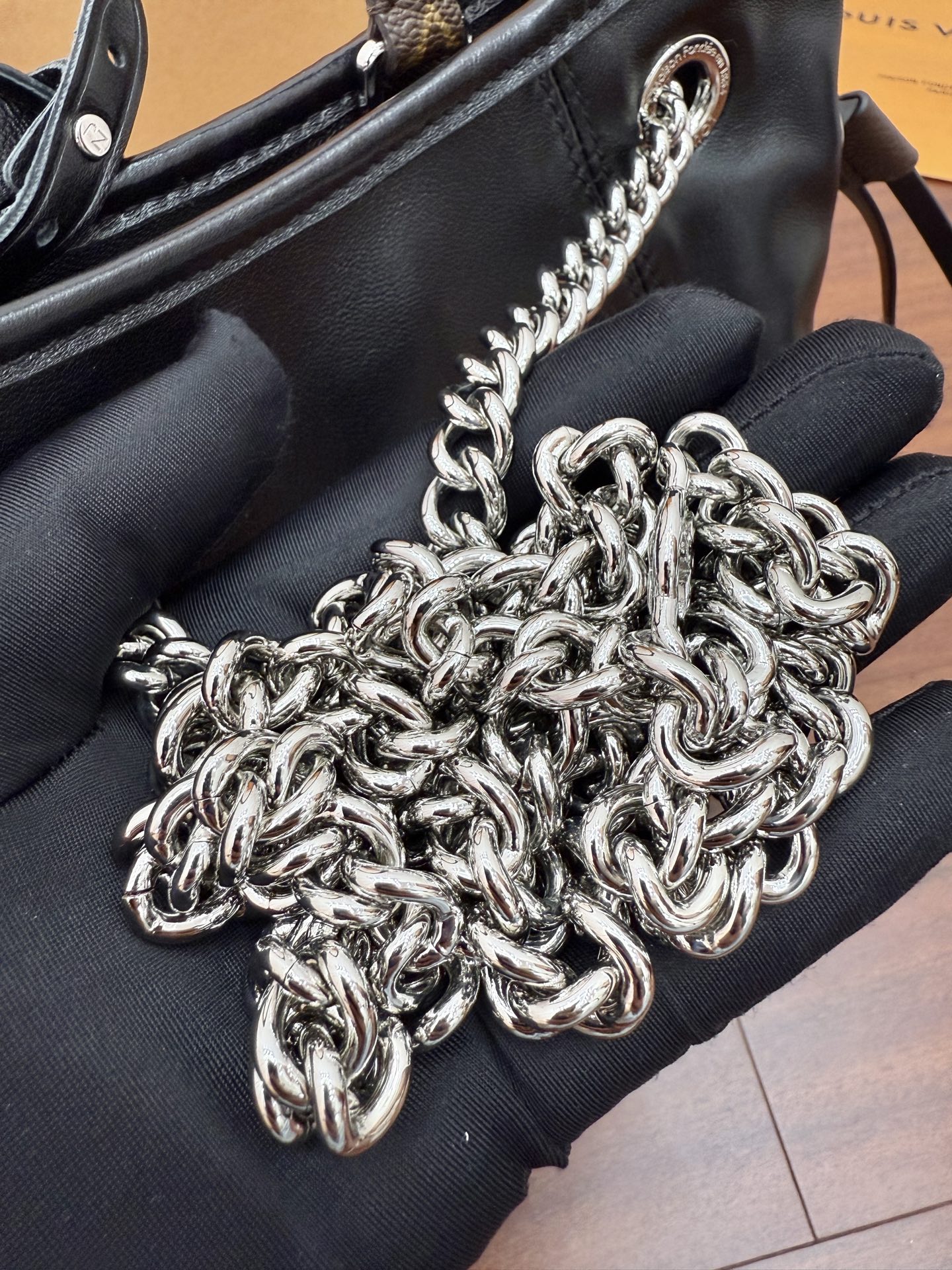Louis Vuitton Black Leather Drawstring Bucket Bag with Chain Accent 9 i1756782616455 936 0 7