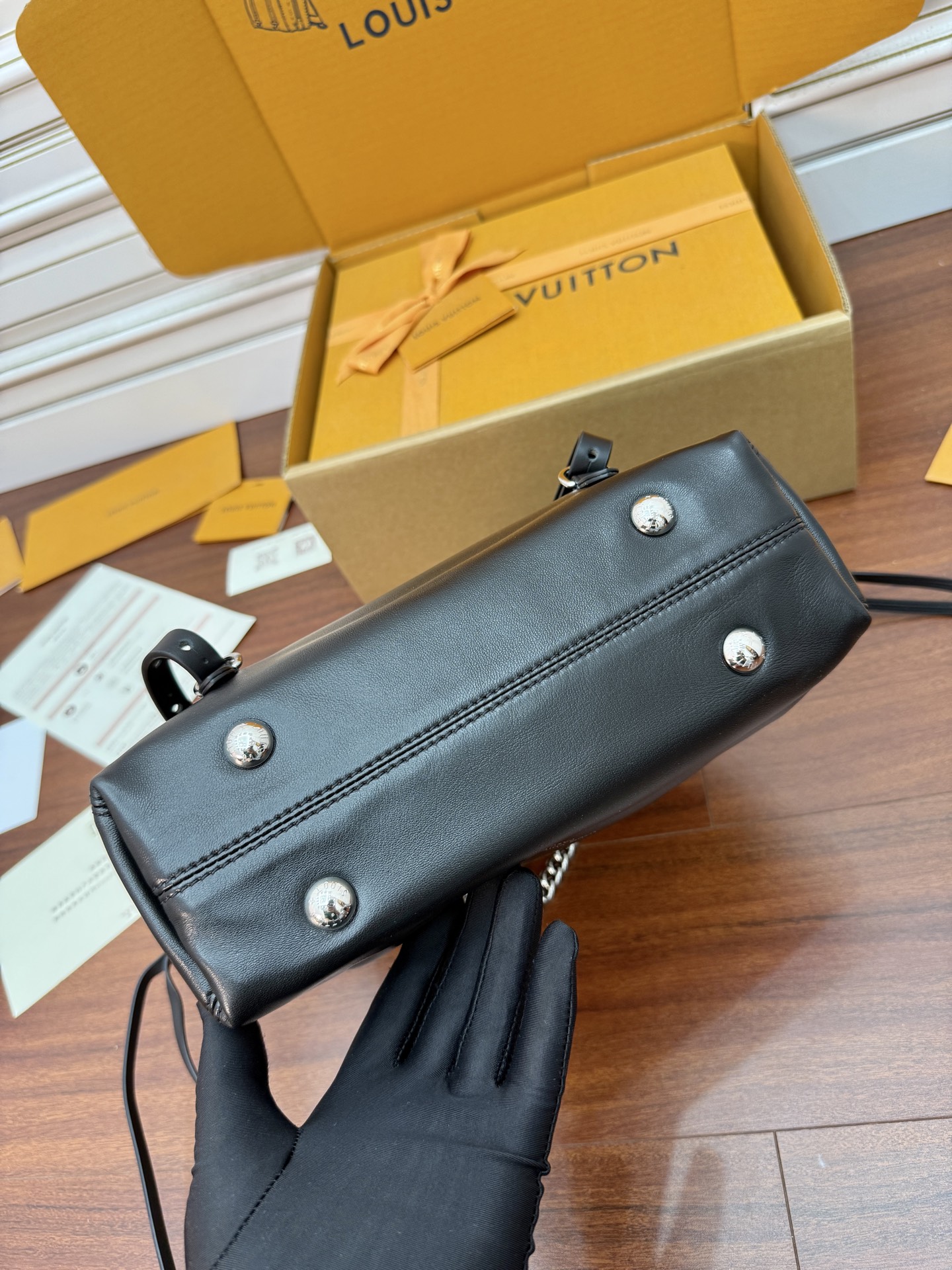 Louis Vuitton Black Leather Drawstring Bucket Bag with Chain Accent 7 i1756782616505 569 0 5