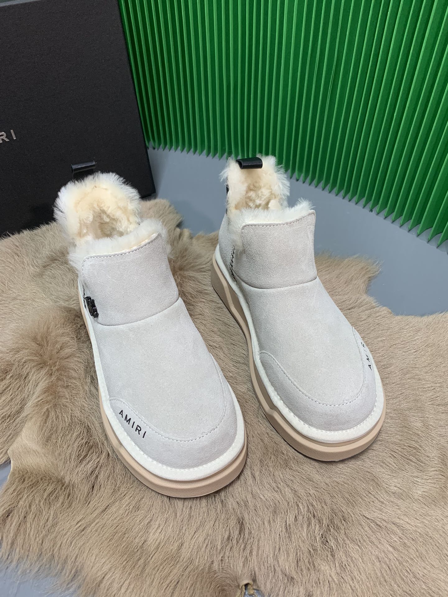 “Amiri Snow Boots: Stylish Design with Real Wool, Priced at $100”
