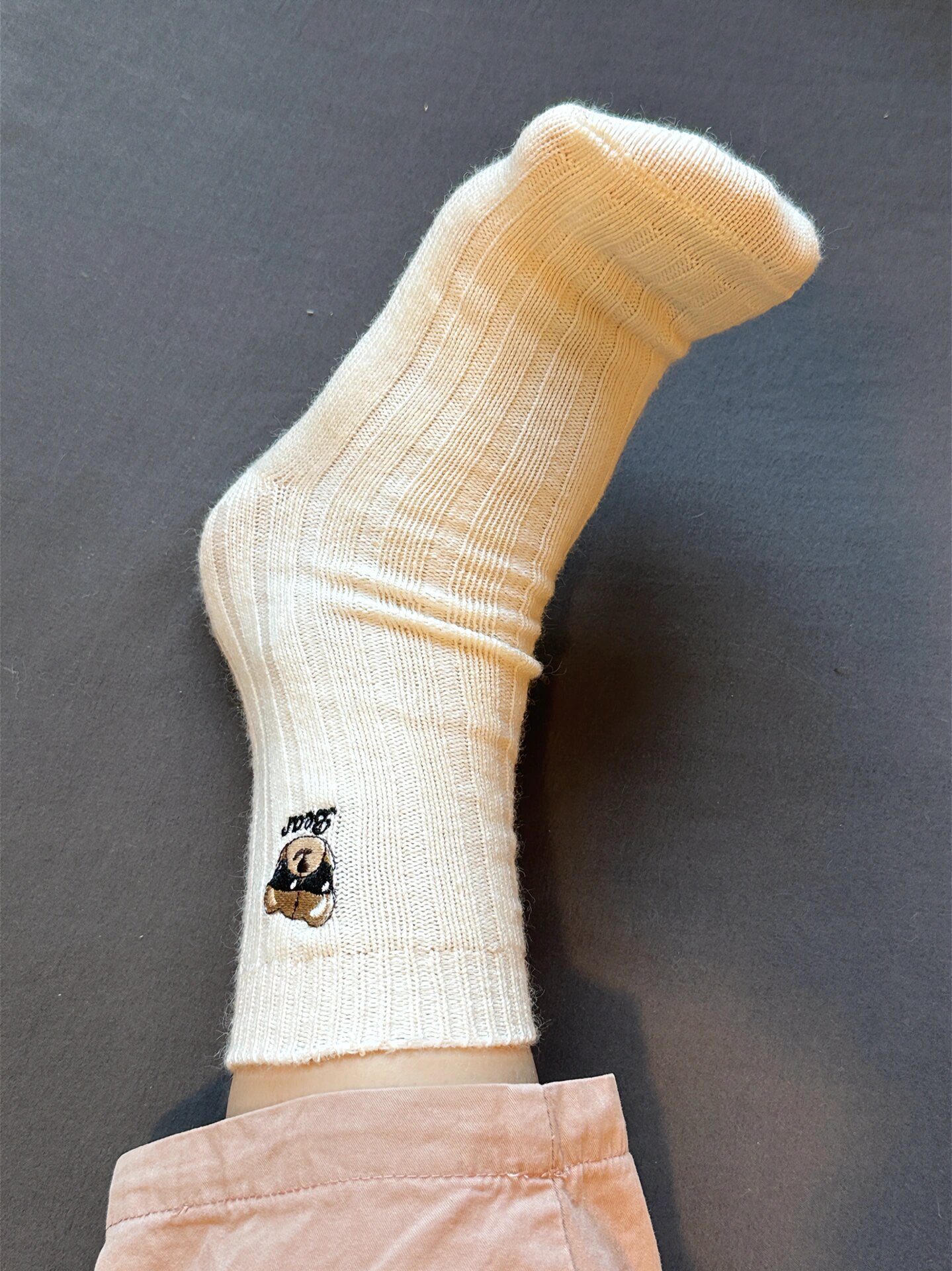 Knit socks featuring detailed bear embroidery and an extended - Comprehensive 2