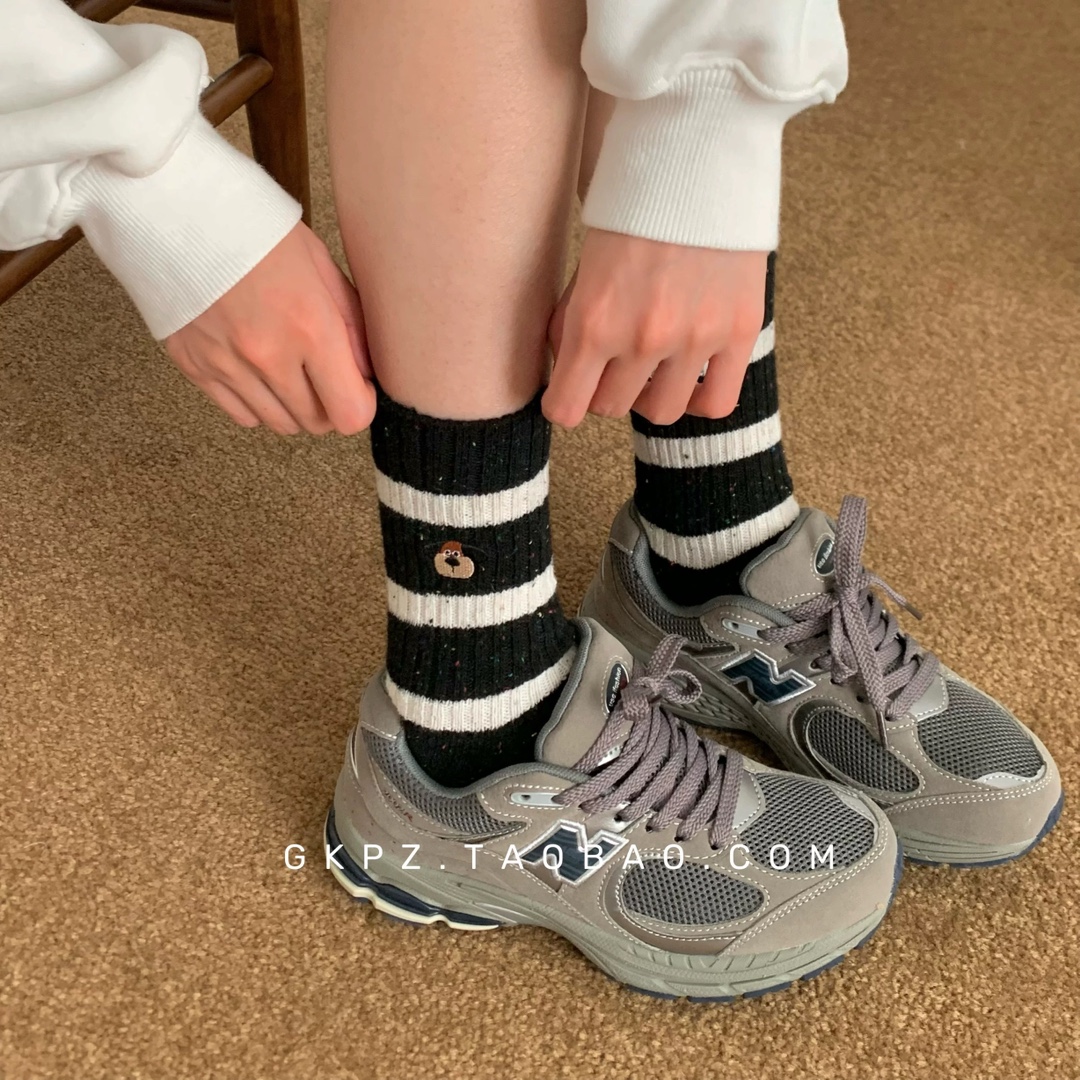 The NONOADER wool socks feature delicate puppy embroidery and an - Underwear 2
