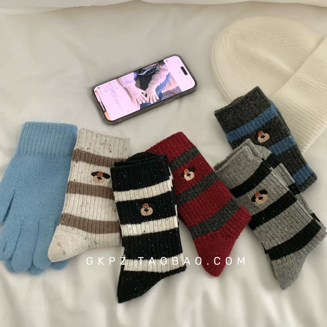 The NONOADER wool socks feature delicate puppy embroidery and an - Underwear
