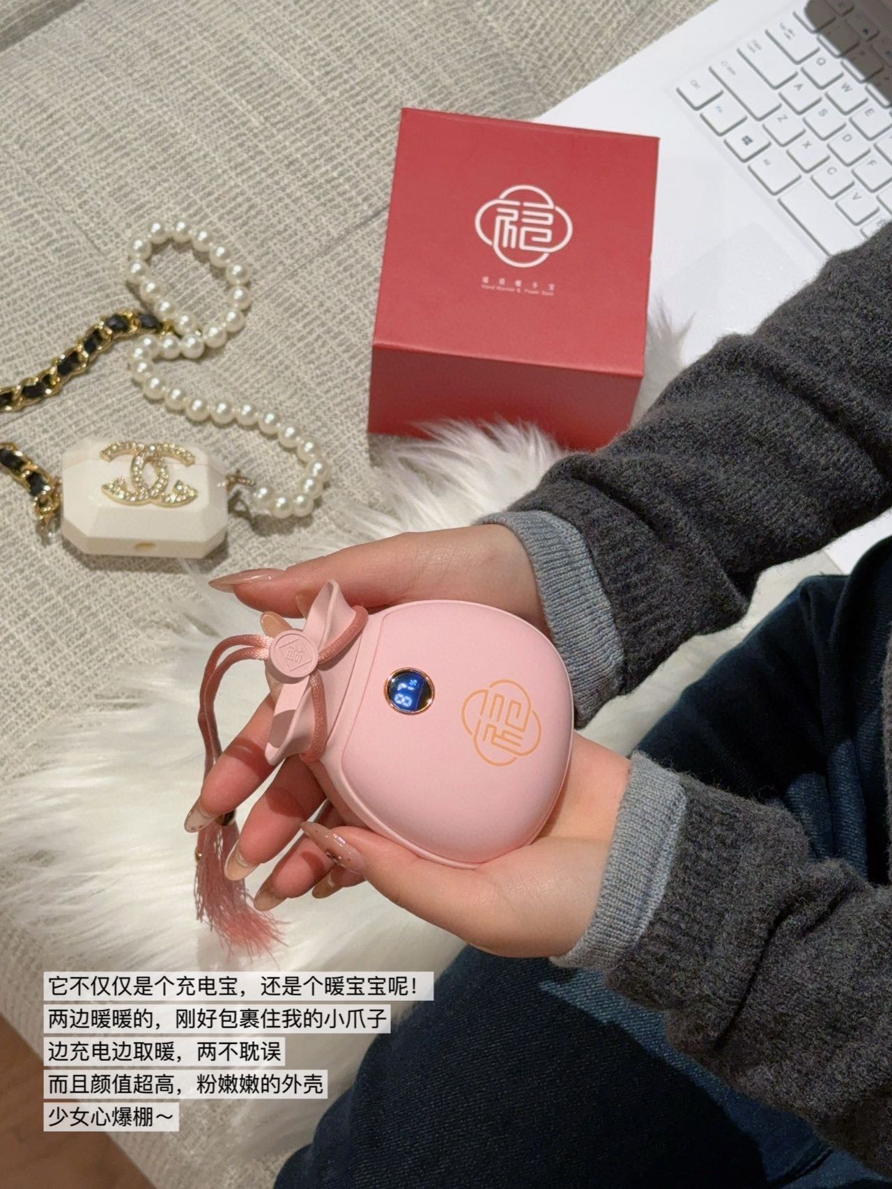 A dual-function portable hand warmer and power bank engineered in a comp - Bag 4