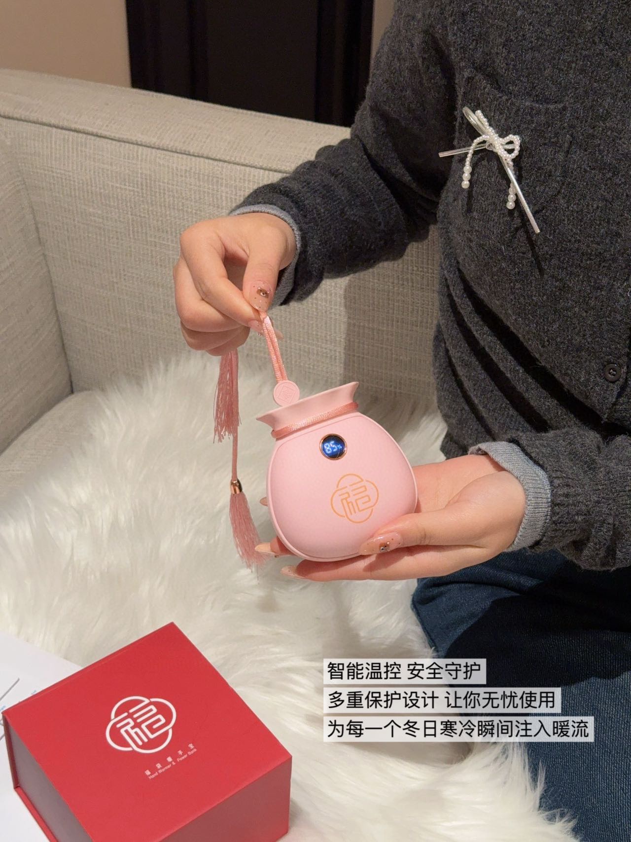 A dual-function portable hand warmer and power bank engineered in a comp - Bag 6