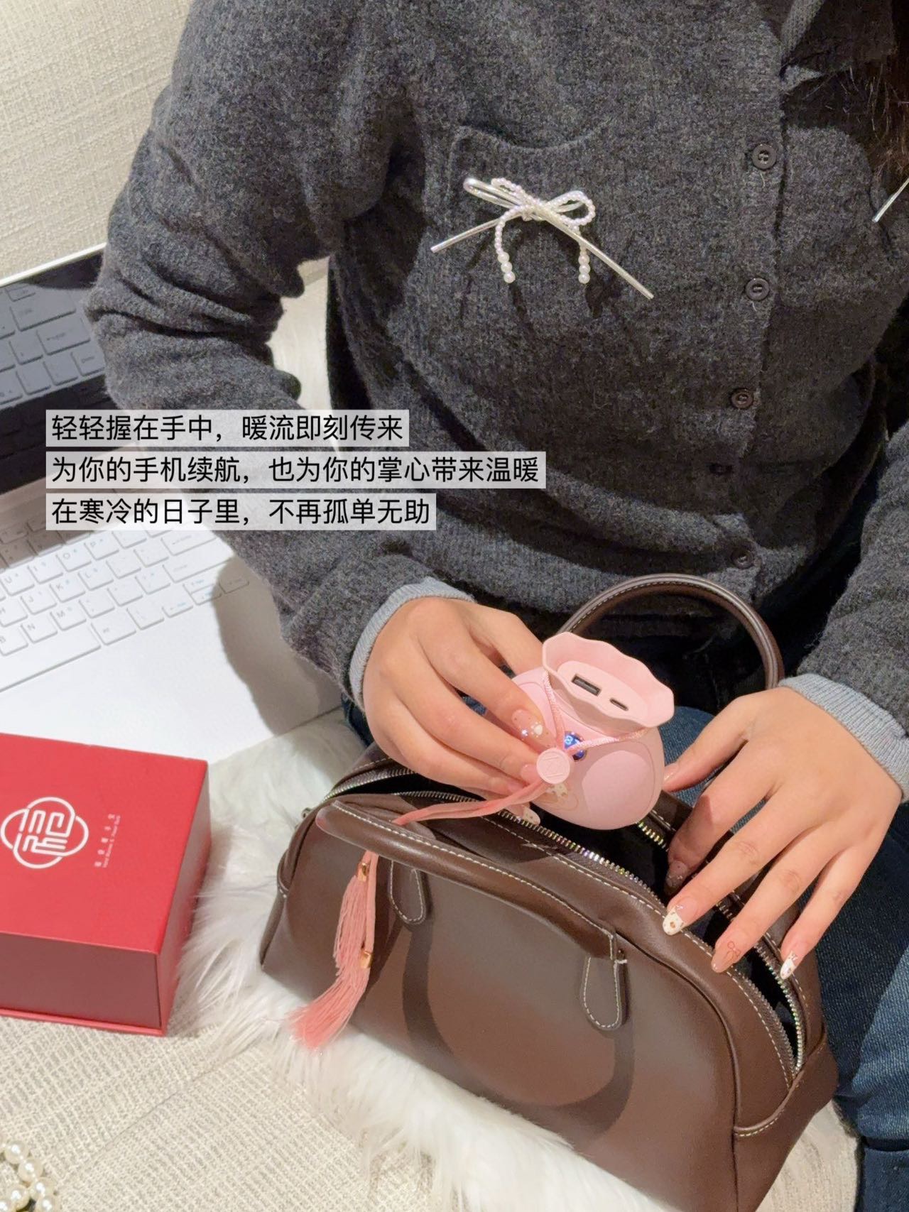 A dual-function portable hand warmer and power bank engineered in a comp - Bag 5