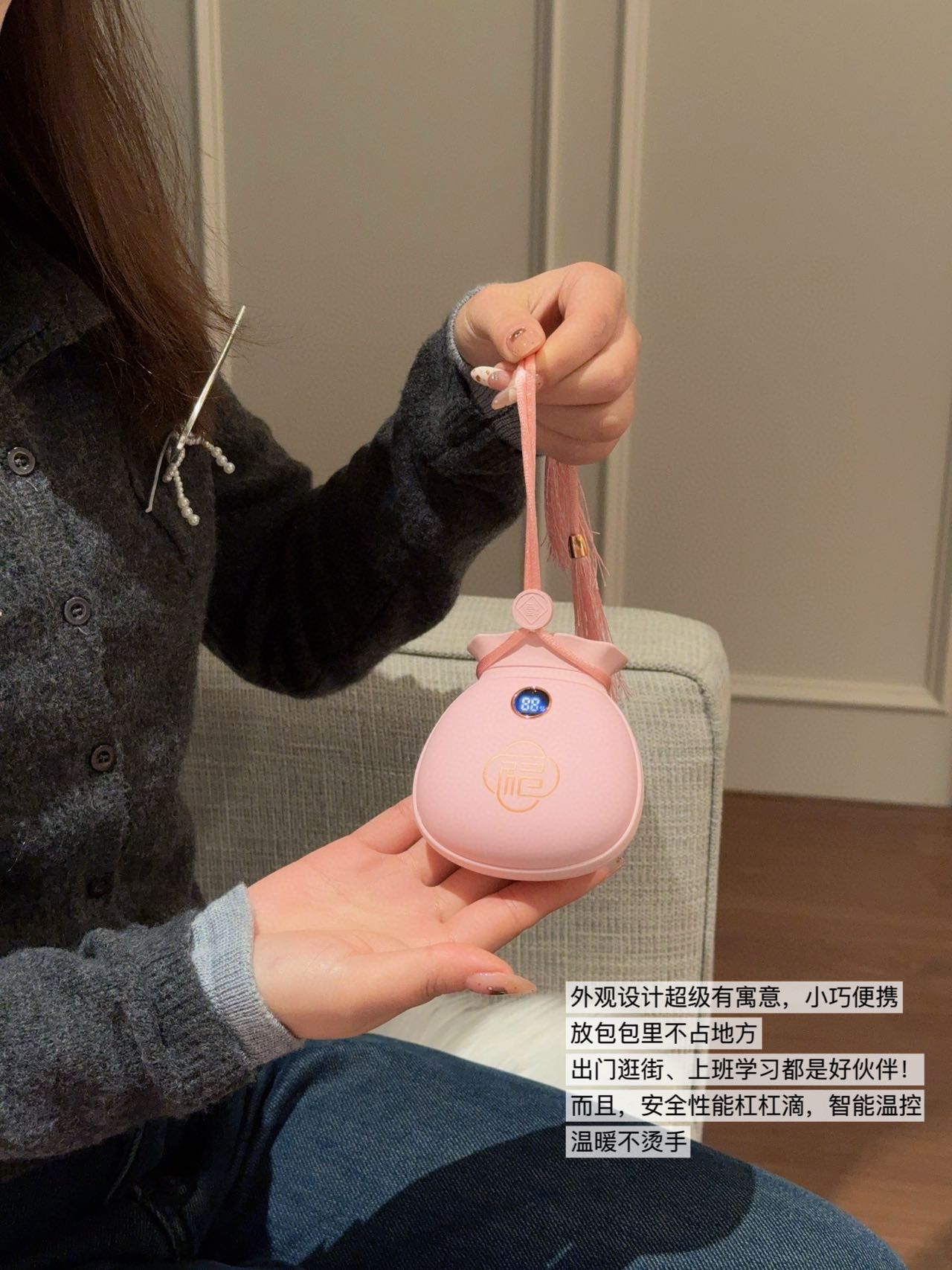 A dual-function portable hand warmer and power bank engineered in a comp - Bag 3