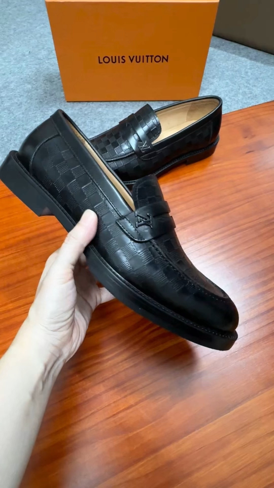 Louis Vuitton Men's Black Leather Loafers with Embossed Monogram Pattern