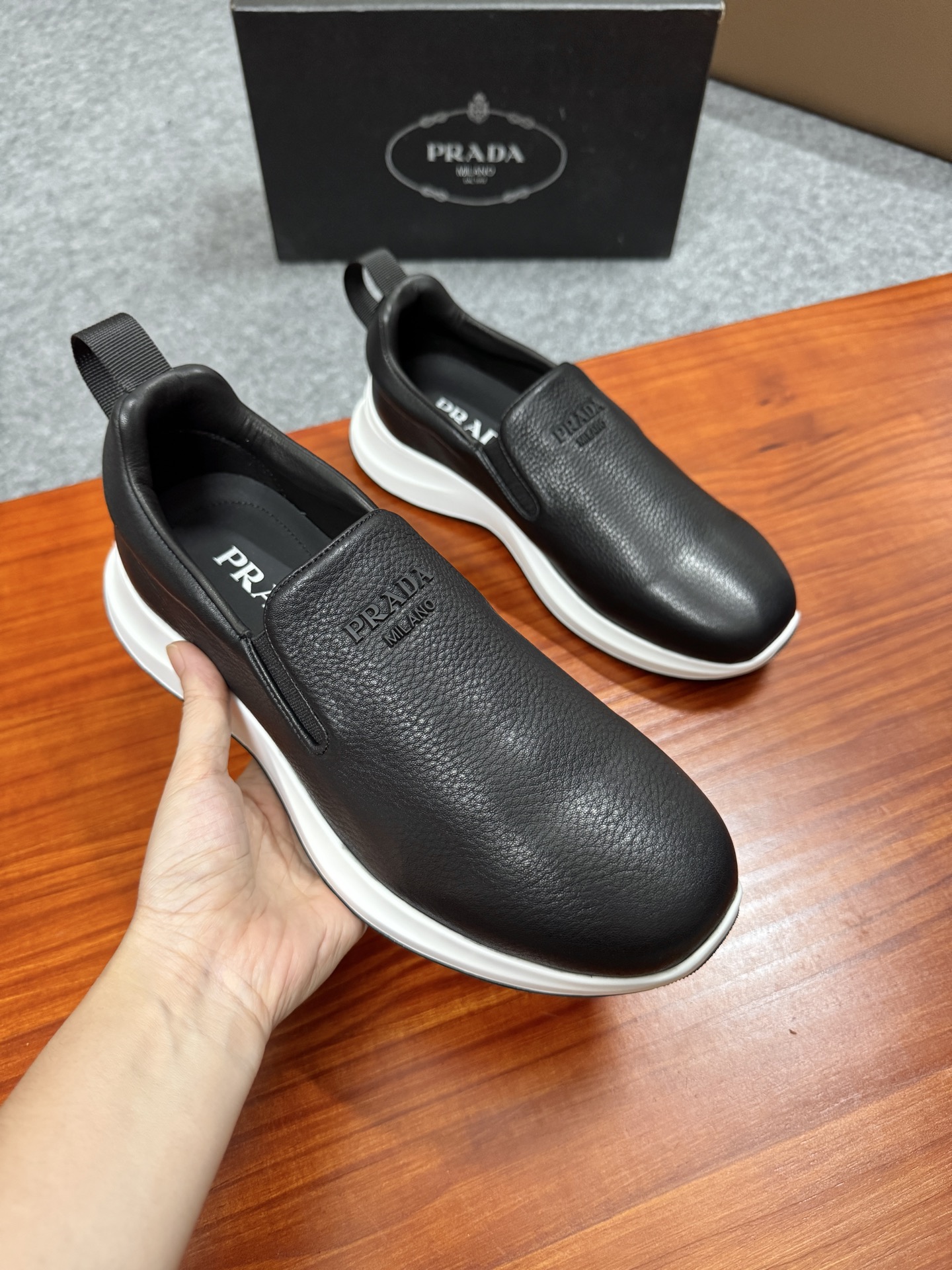 Prada Men's Black Leather Slip-On Sneakers With White Ultra-Light Sole 5 i1755596534628 84 0 3