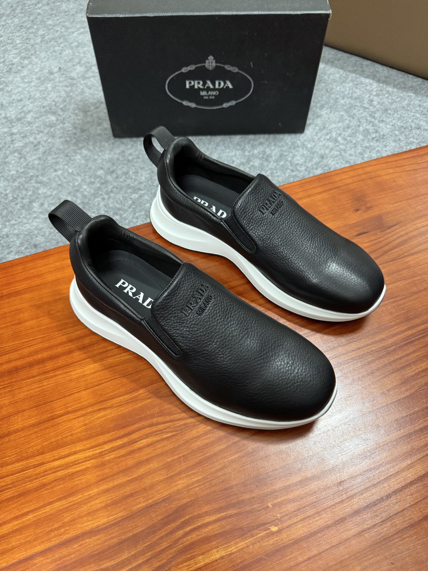 Prada Men's Black Leather Slip-On Sneakers With White Ultra-Light Sole 2 i1755596534875 3603 0 0